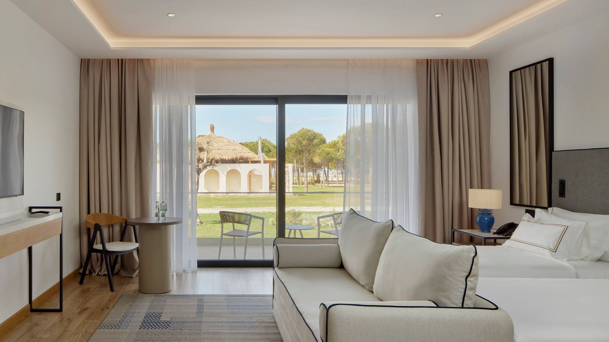 a living room with a couch and a table and chairs