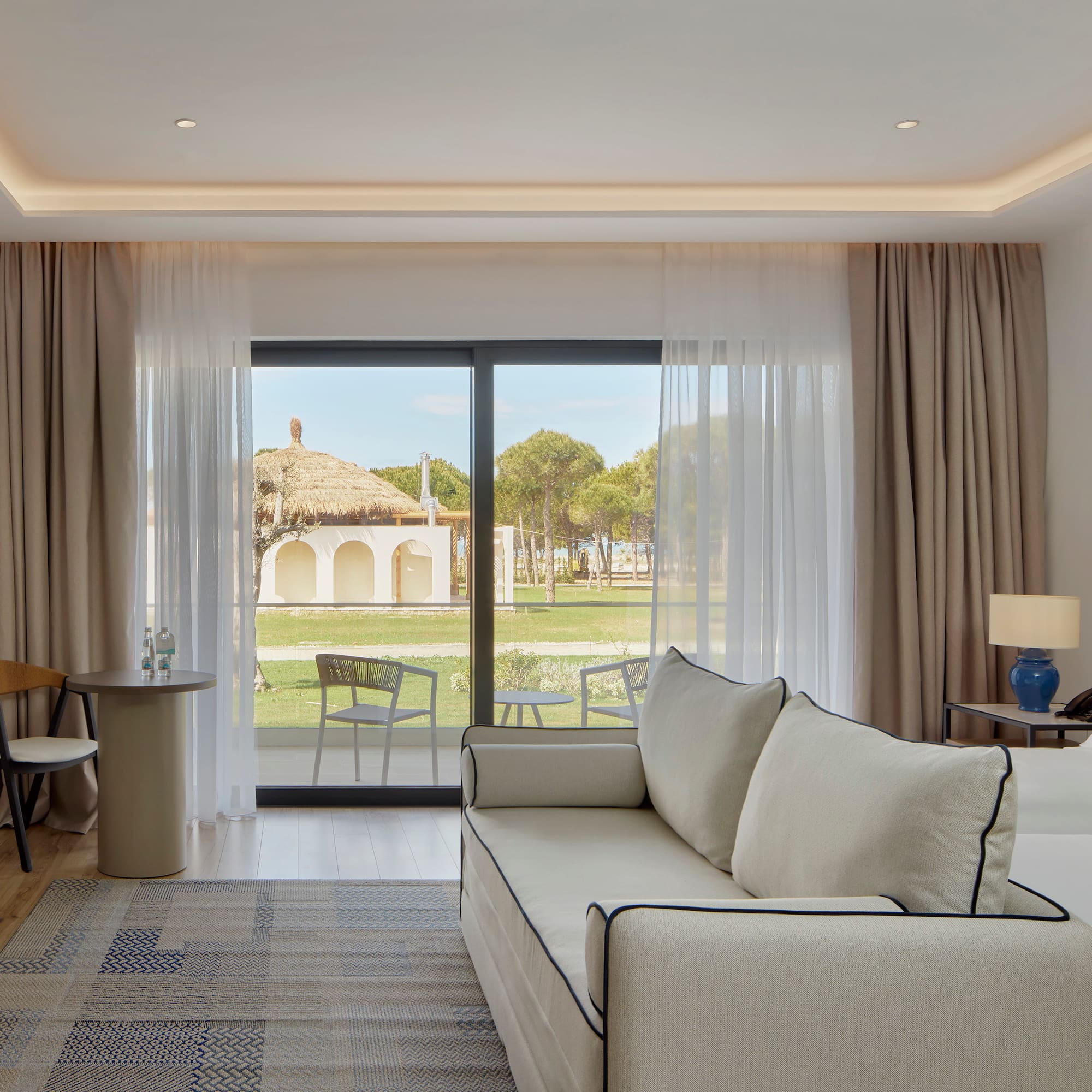 a living room with a couch and a table and chairs