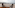 two chairs on a balcony overlooking a city
