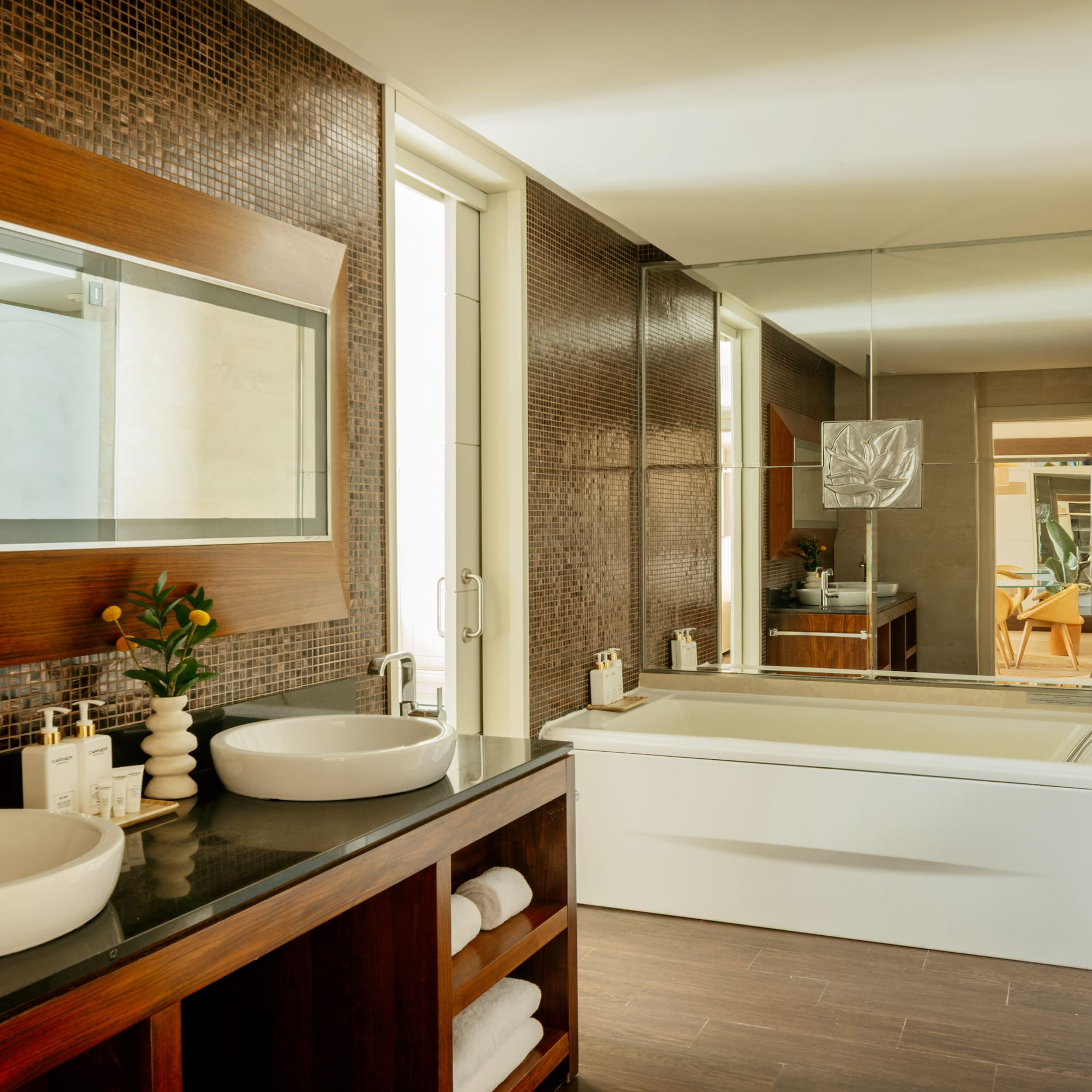 a bathroom with a large mirror and sink