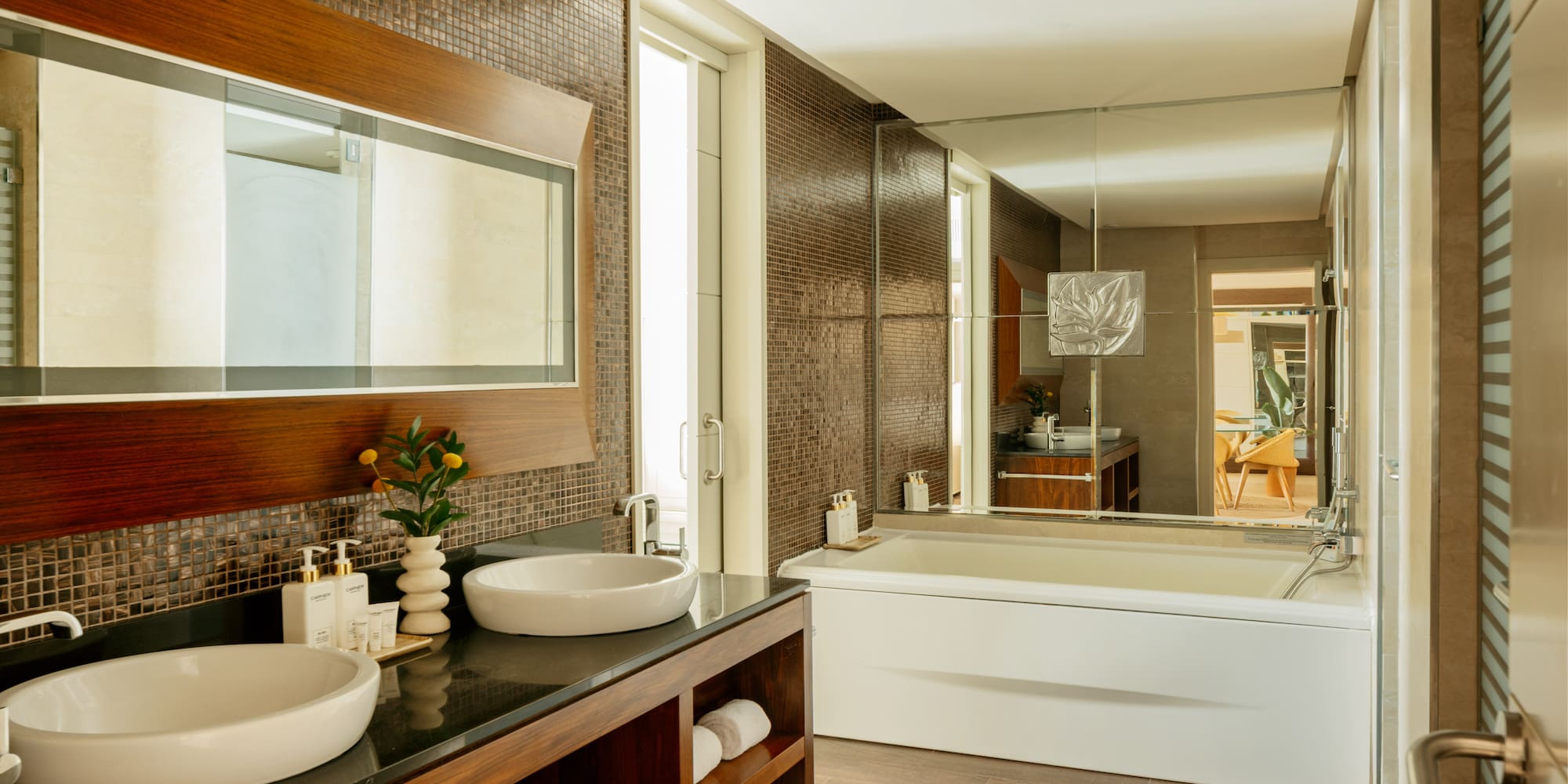 a bathroom with a large mirror and sink