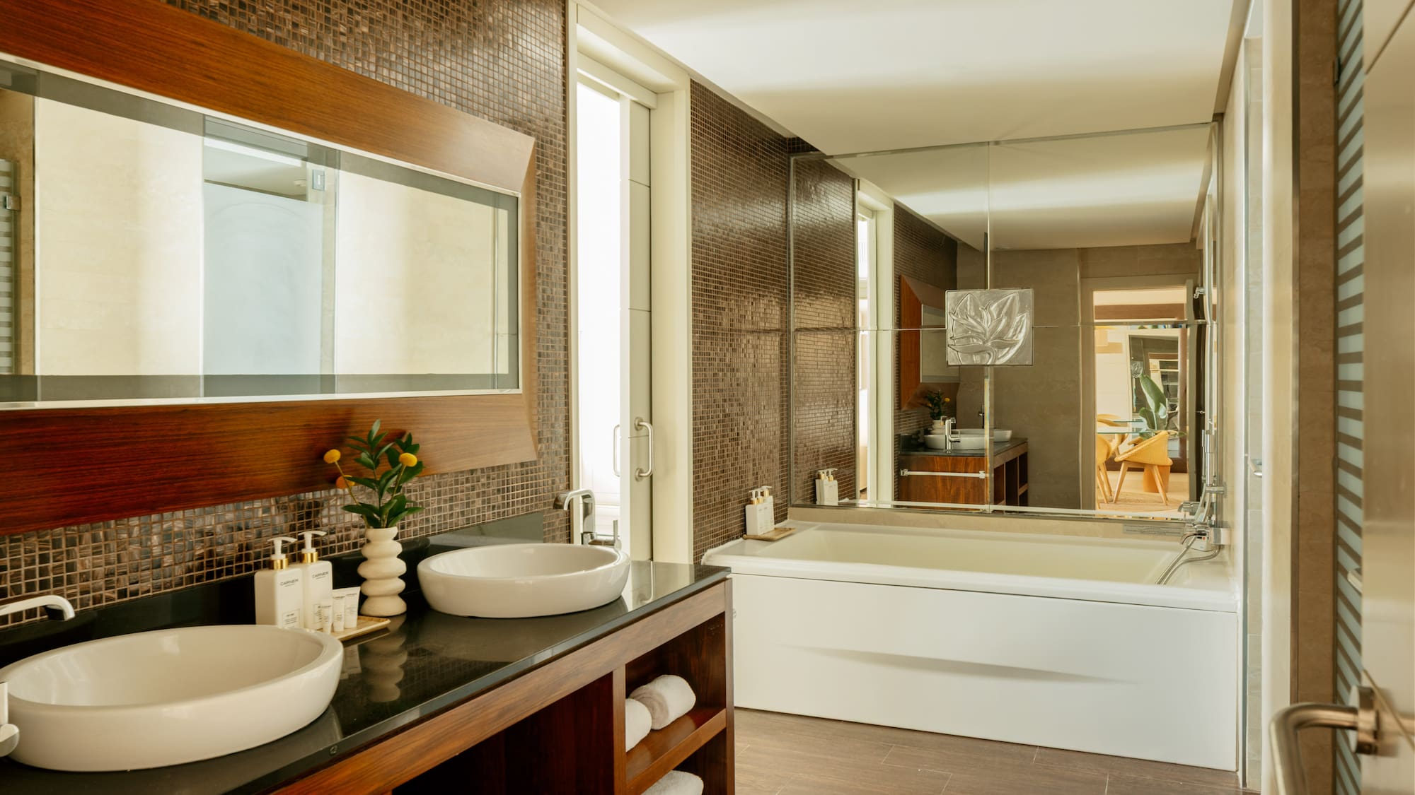 a bathroom with a large mirror and sink