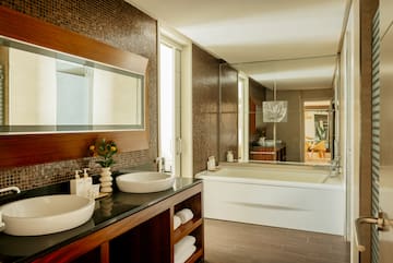 a bathroom with a large mirror and sink