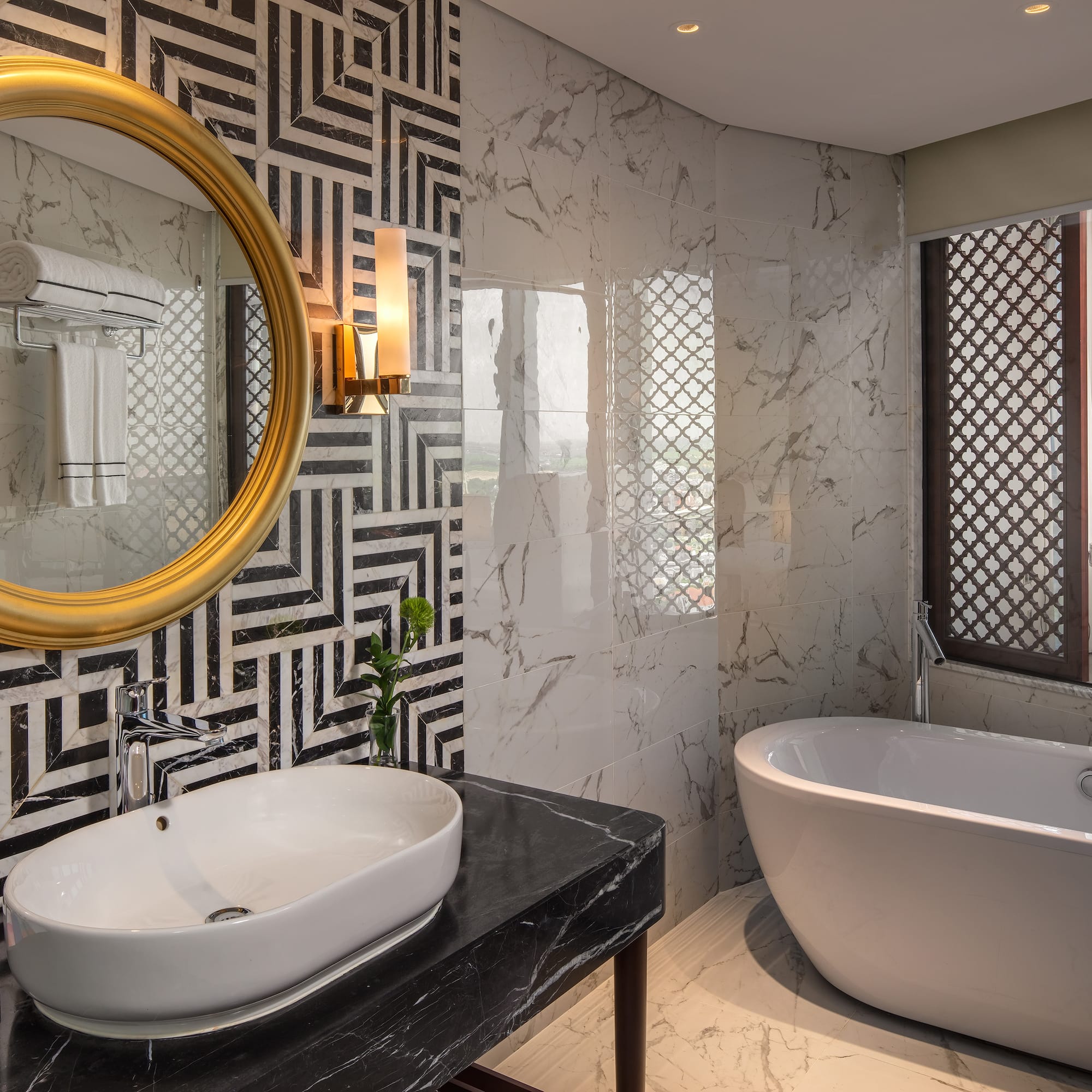 a bathroom with a tub and a sink