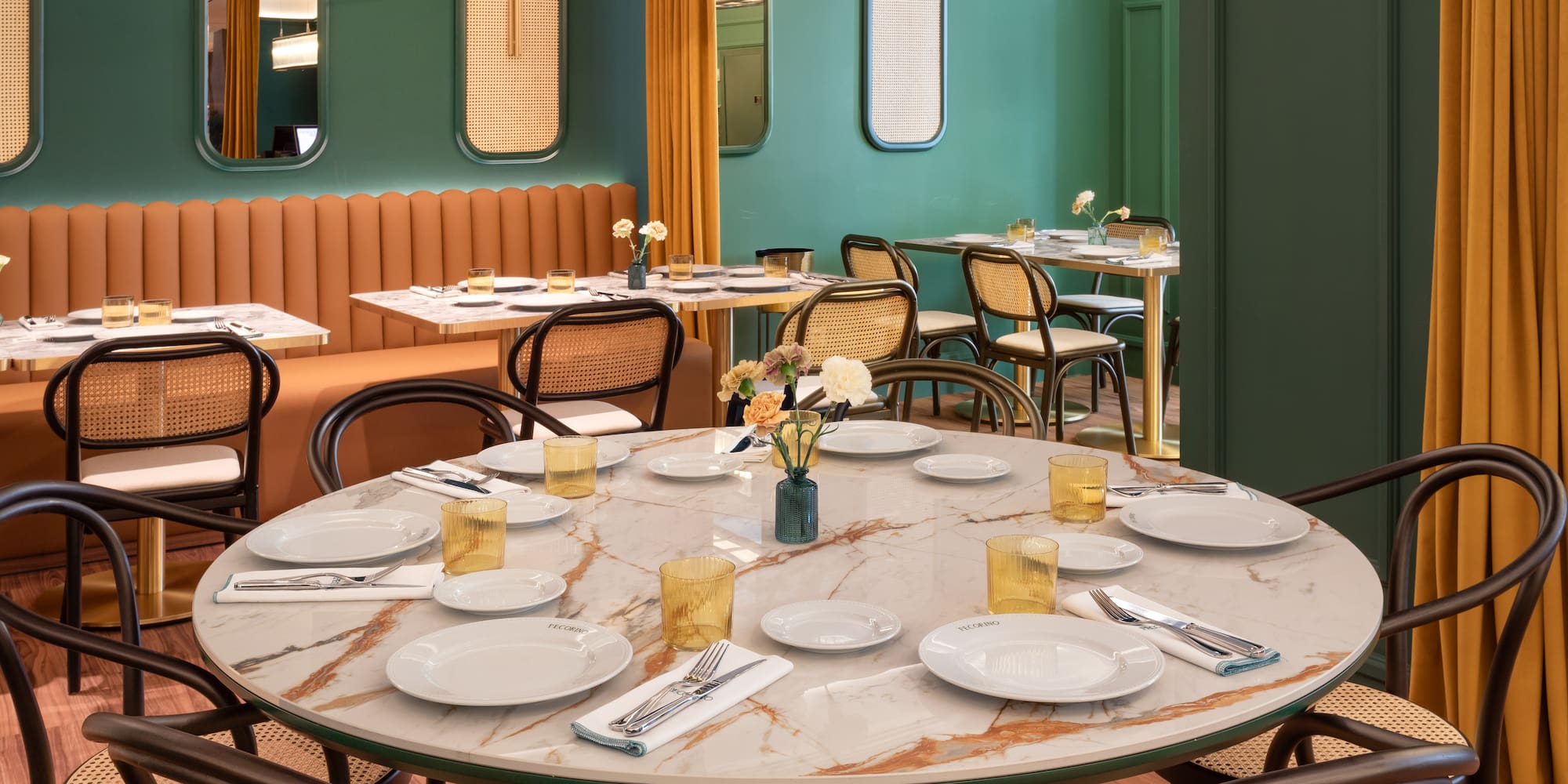 a table with plates and silverware in a restaurant