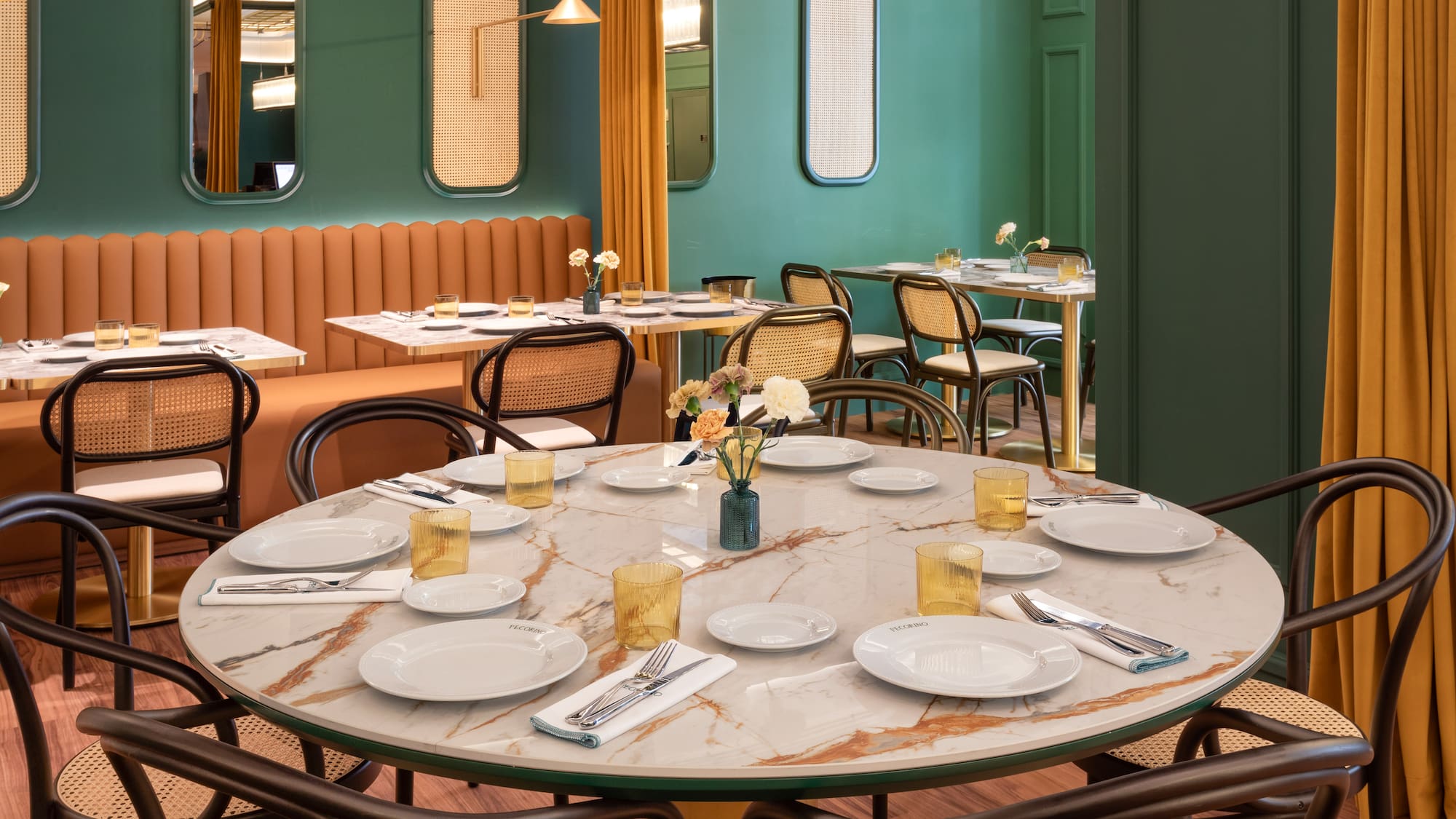 a table with plates and silverware in a restaurant