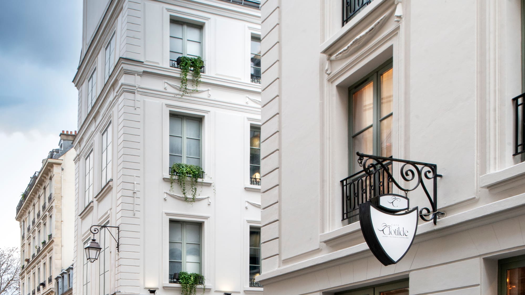 a white building with a sign on the side
