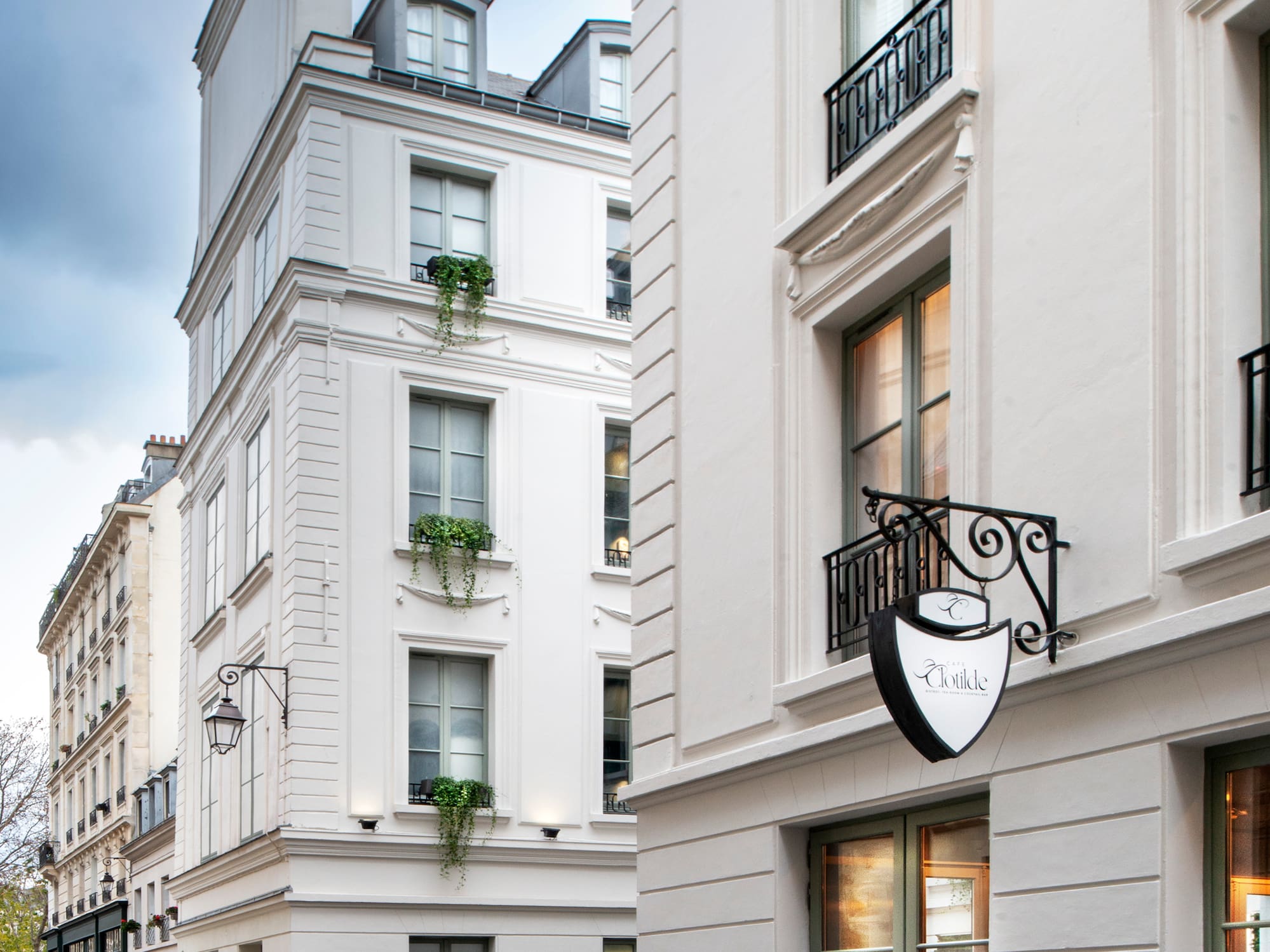 a white building with a sign on the side