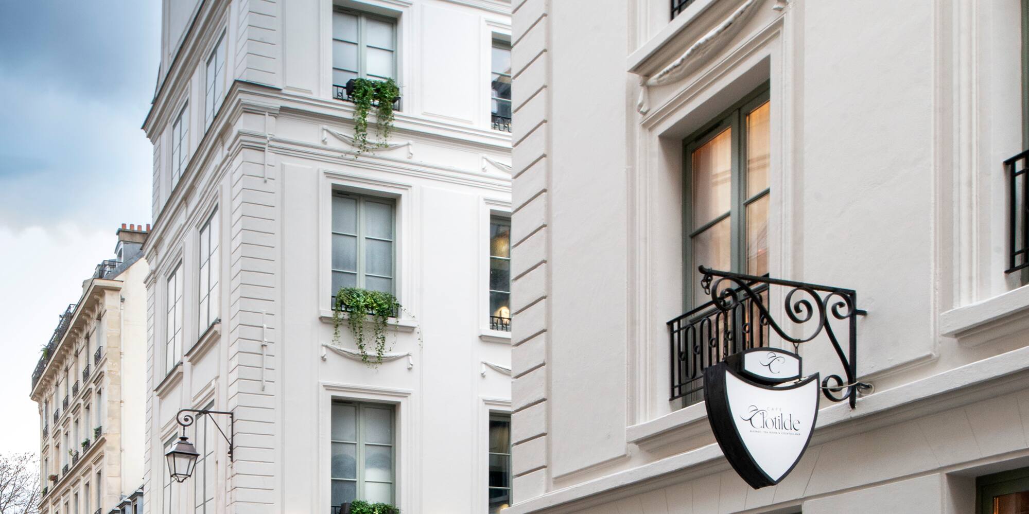 a white building with a sign on the side