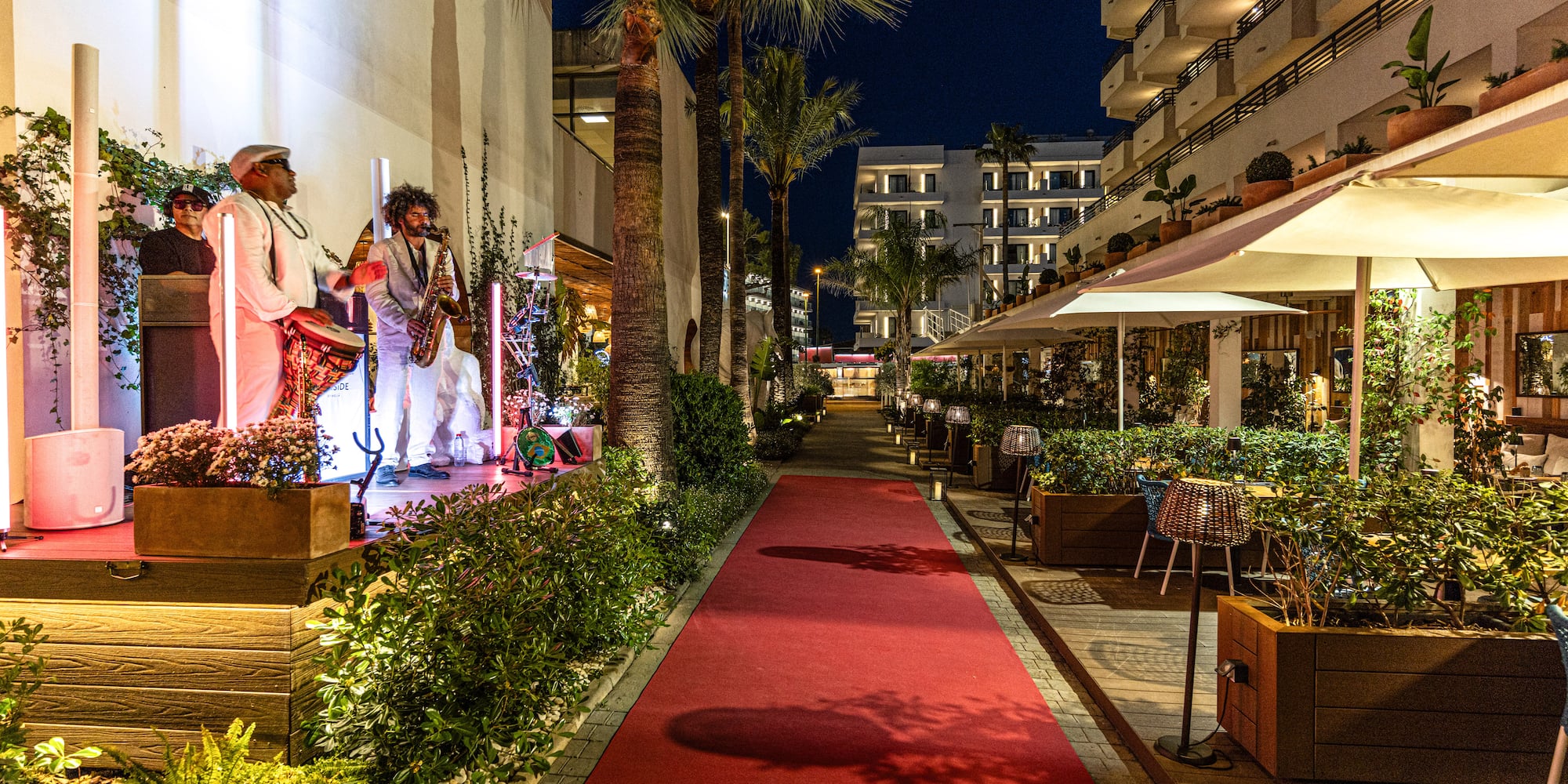 a group of people playing instruments outside of a building