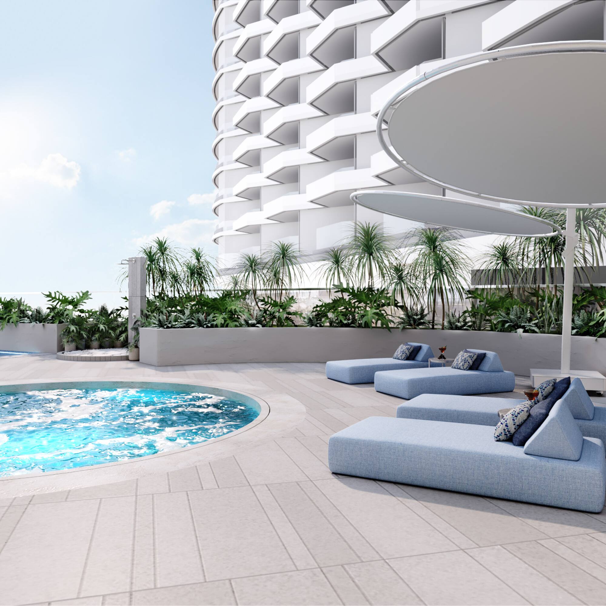 a pool with lounge chairs and a large building