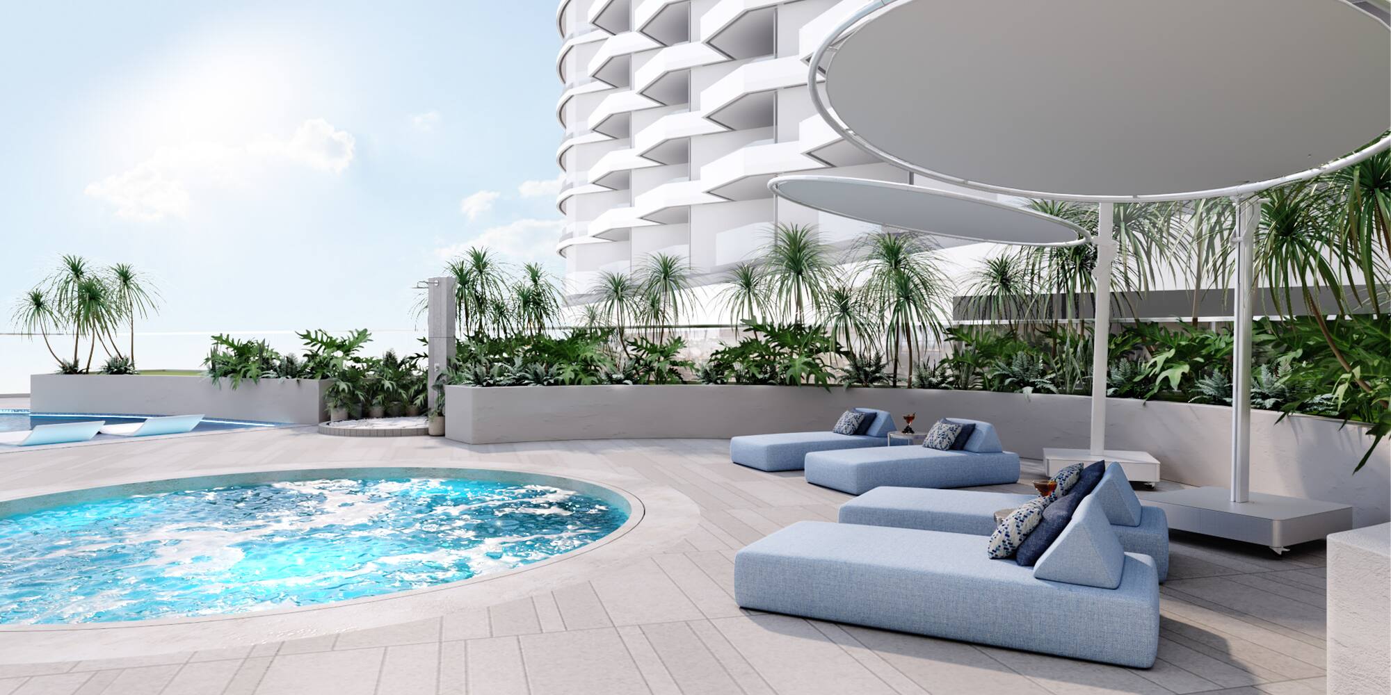 a pool with lounge chairs and a large building