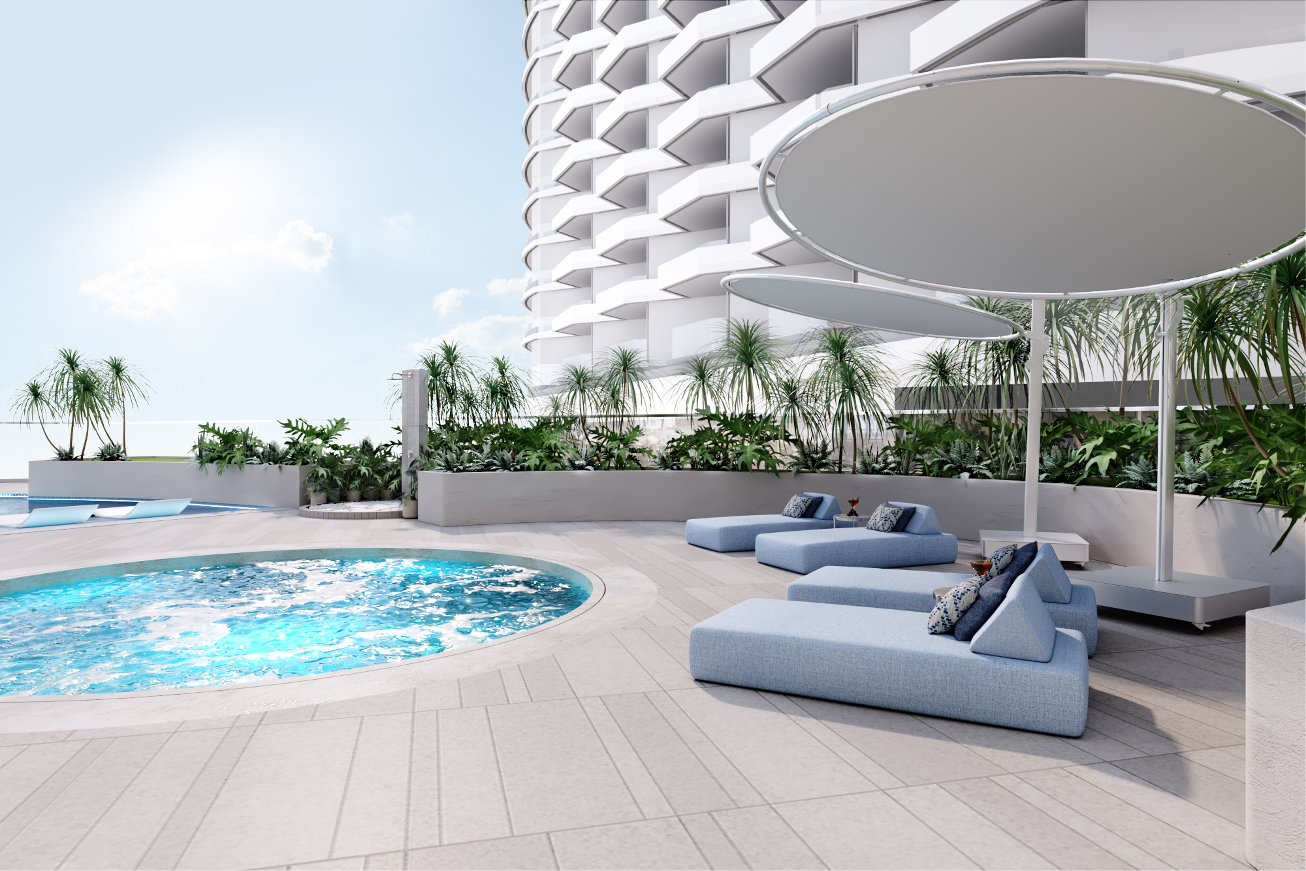 Modern rooftop pool with blue daybeds, white building, and tropical plants.