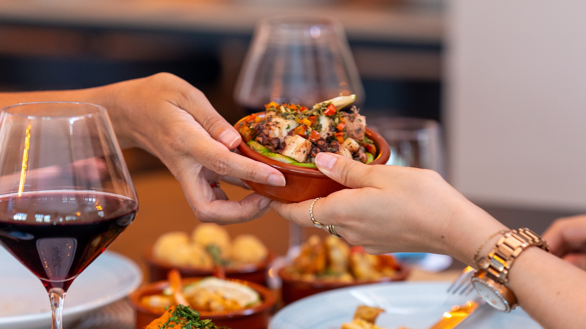 a person handing food to another person