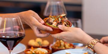 a person handing food to another person