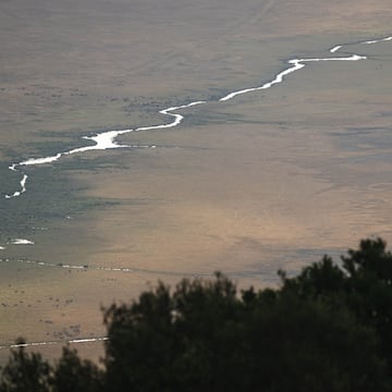 a river running through a dry land