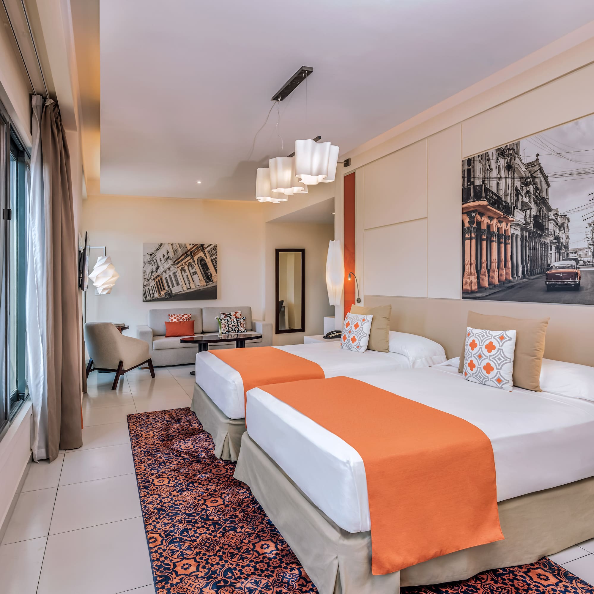 a room with two beds and a picture on the wall