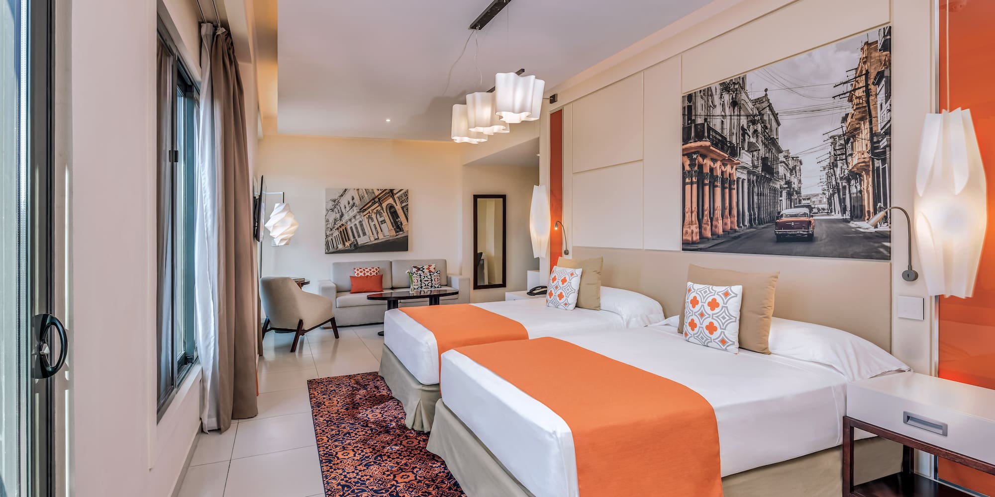 a room with two beds and a picture on the wall