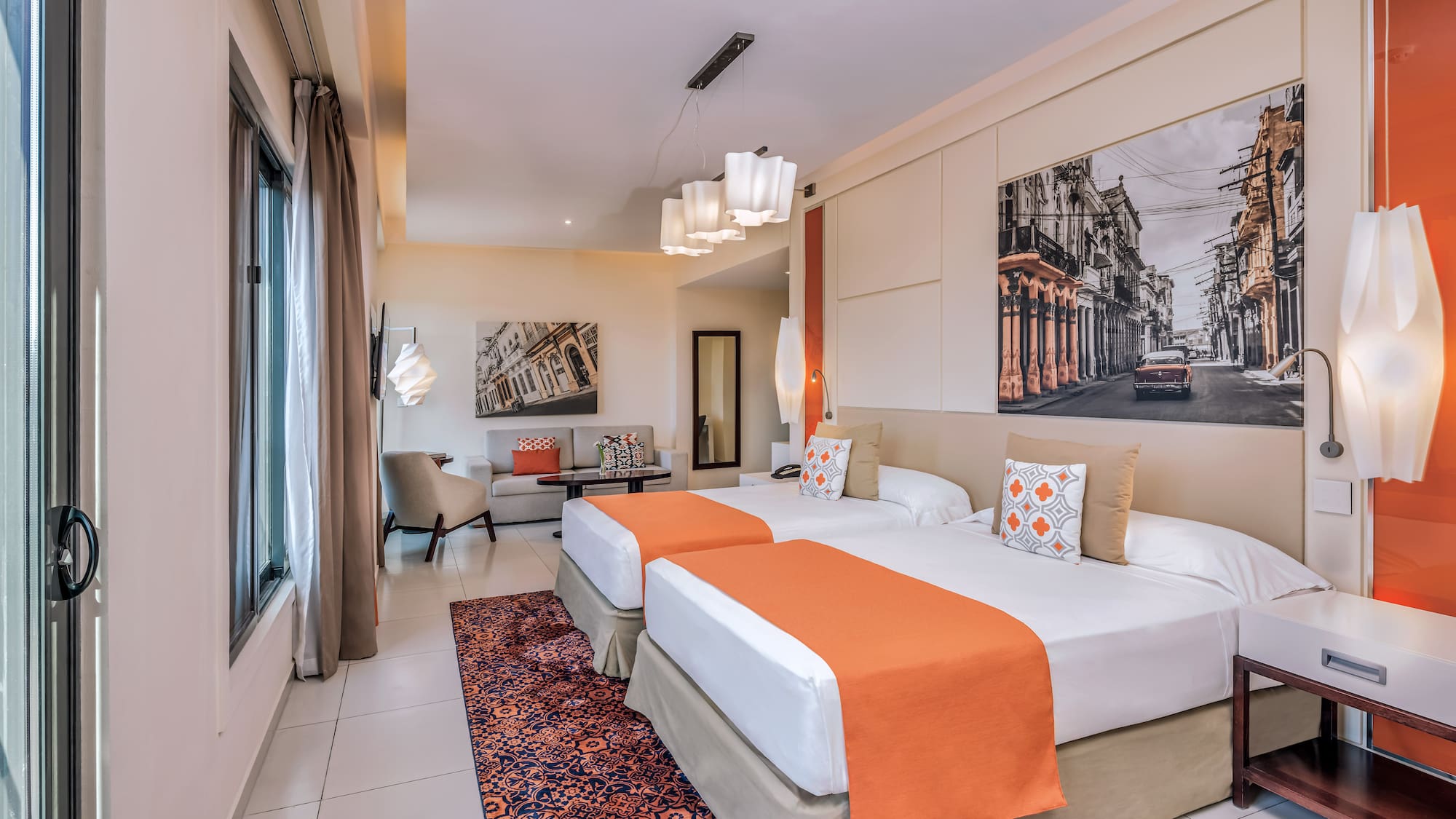 a room with two beds and a picture on the wall