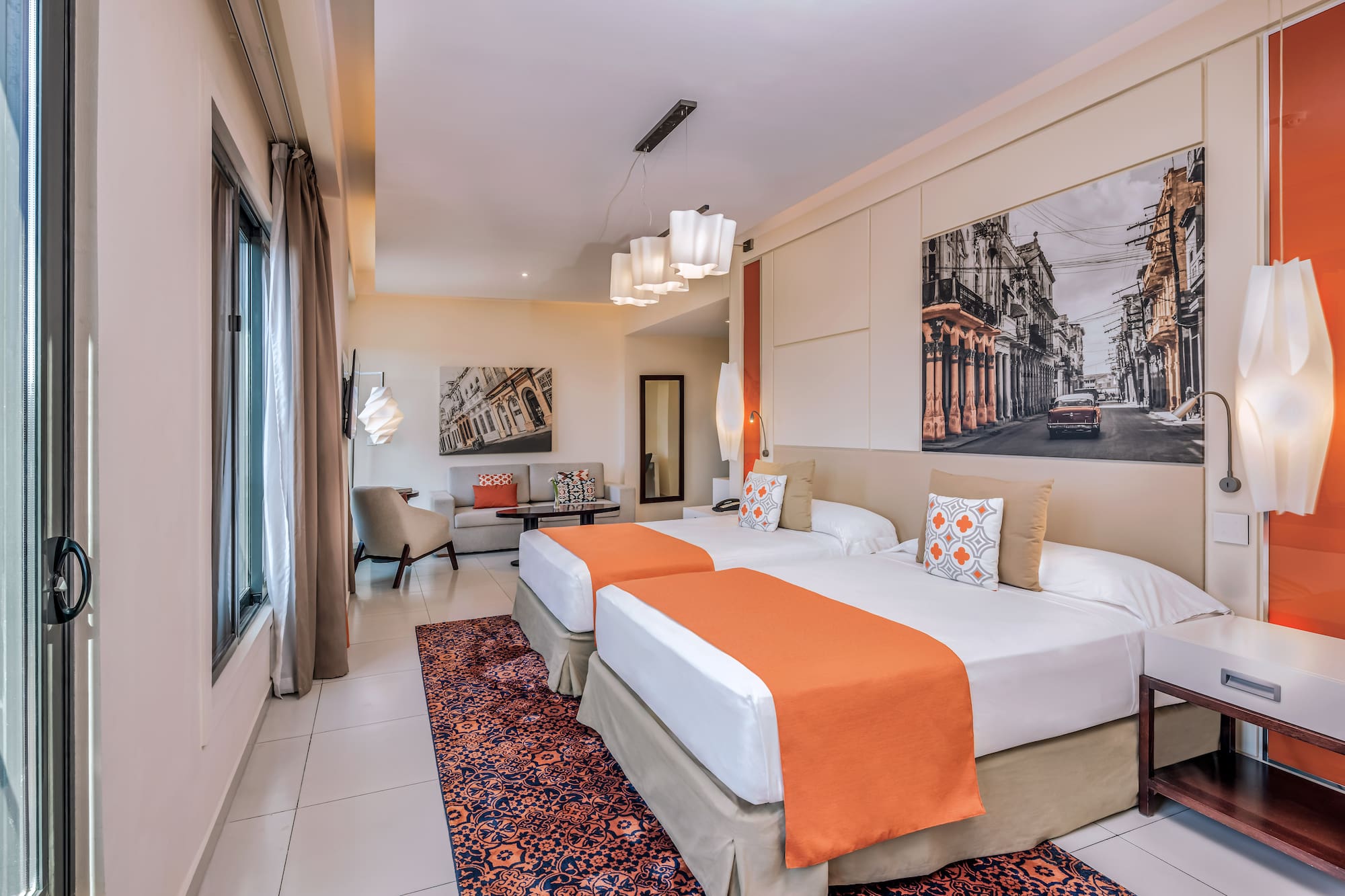 a room with two beds and a picture on the wall