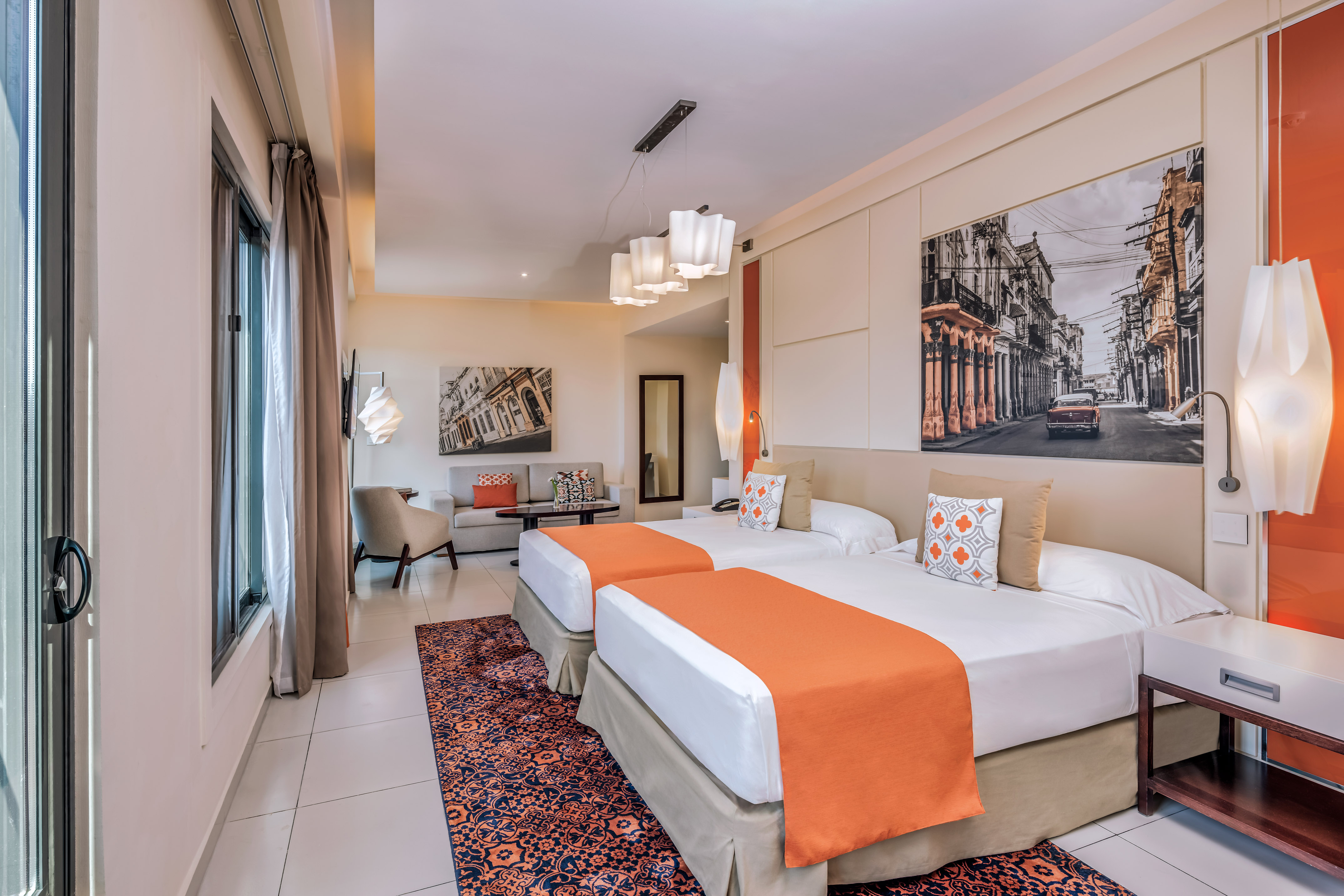 a room with two beds and a picture on the wall