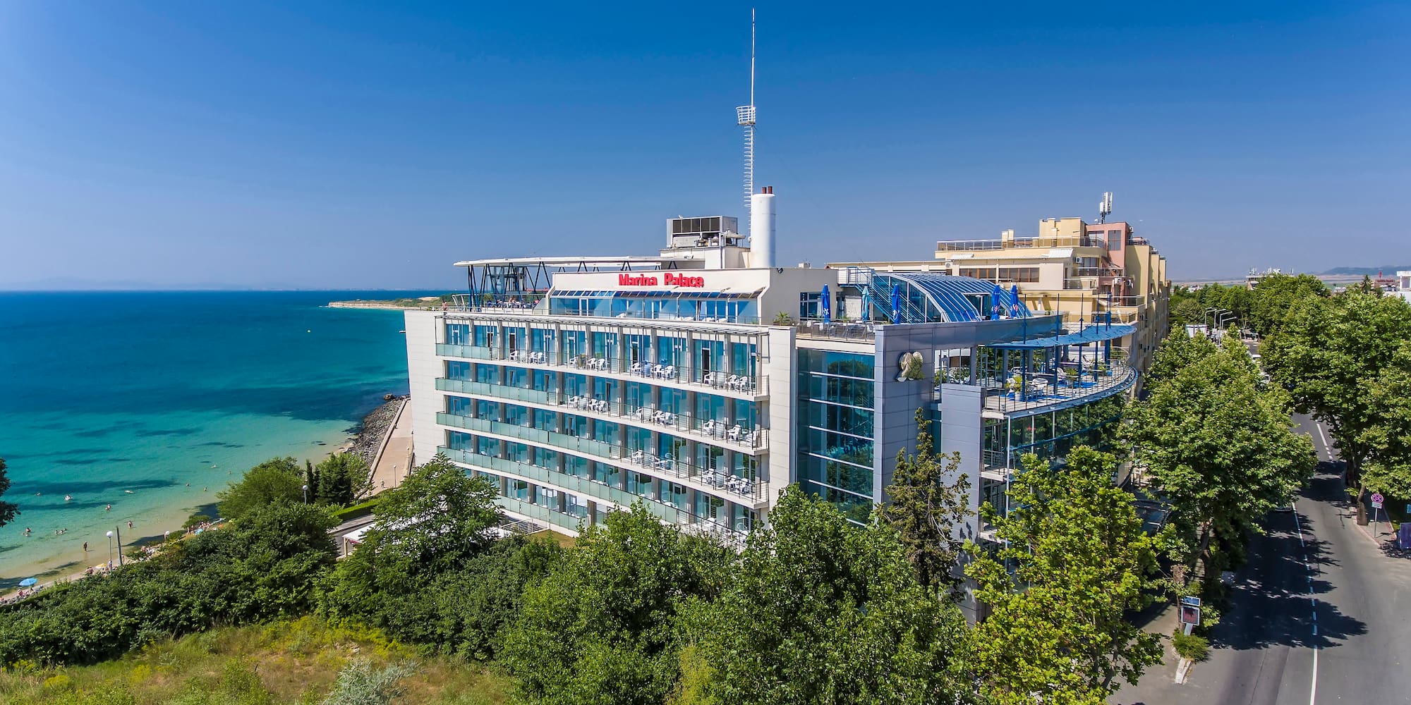 a building with many windows and a body of water