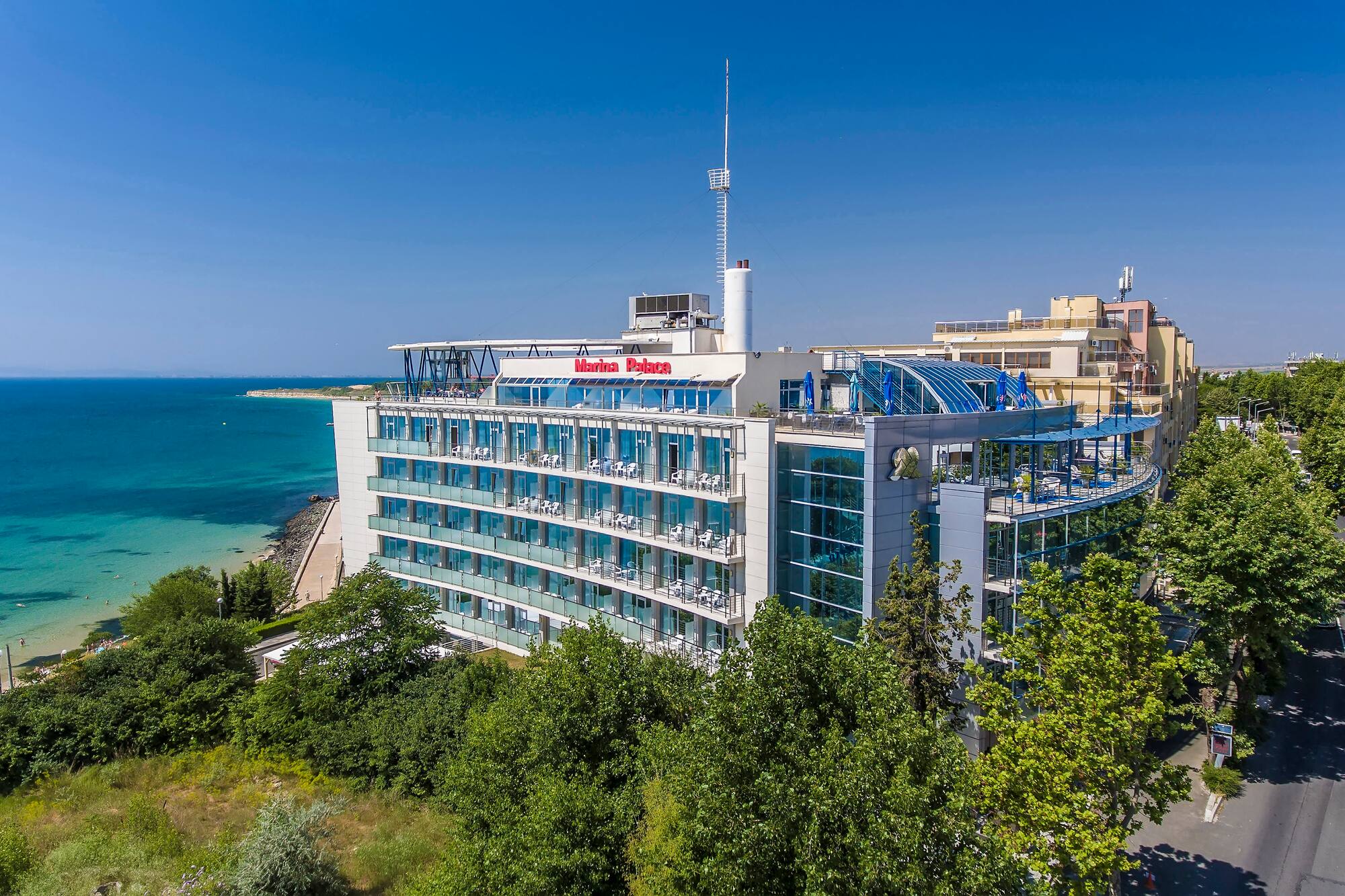 a building with many windows and a body of water