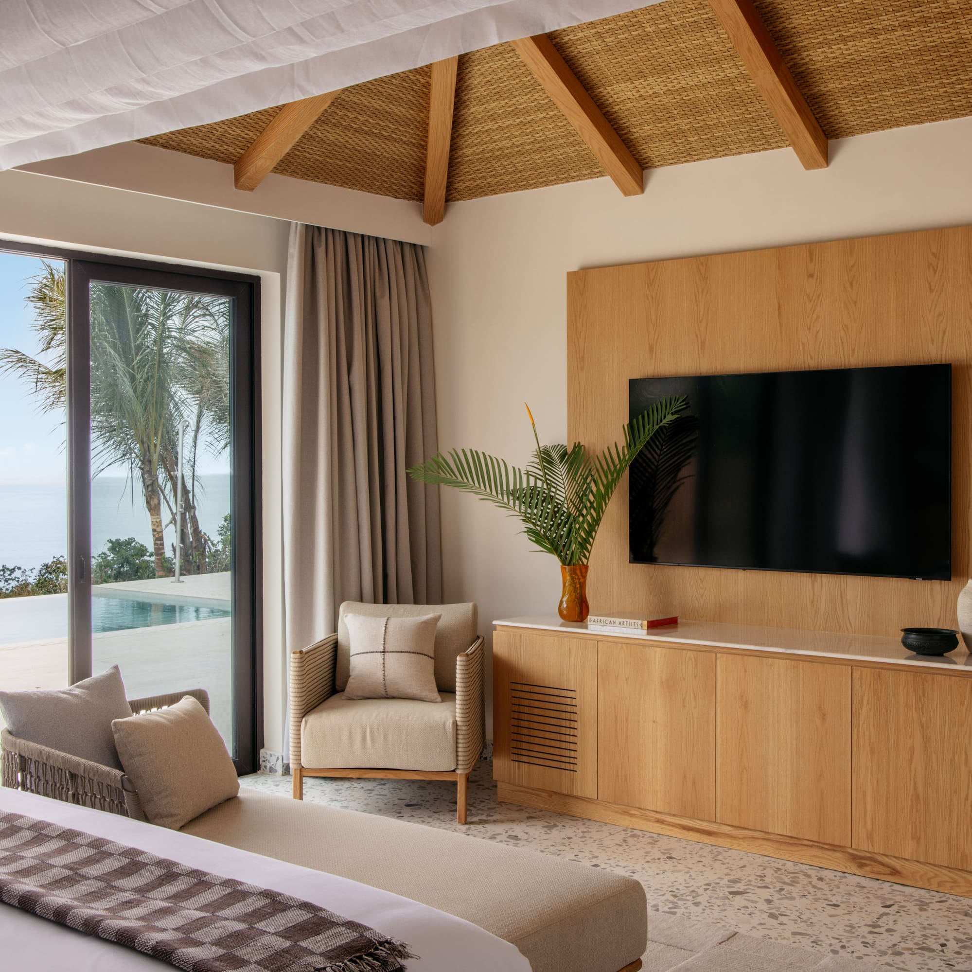 a room with a television and a large bed