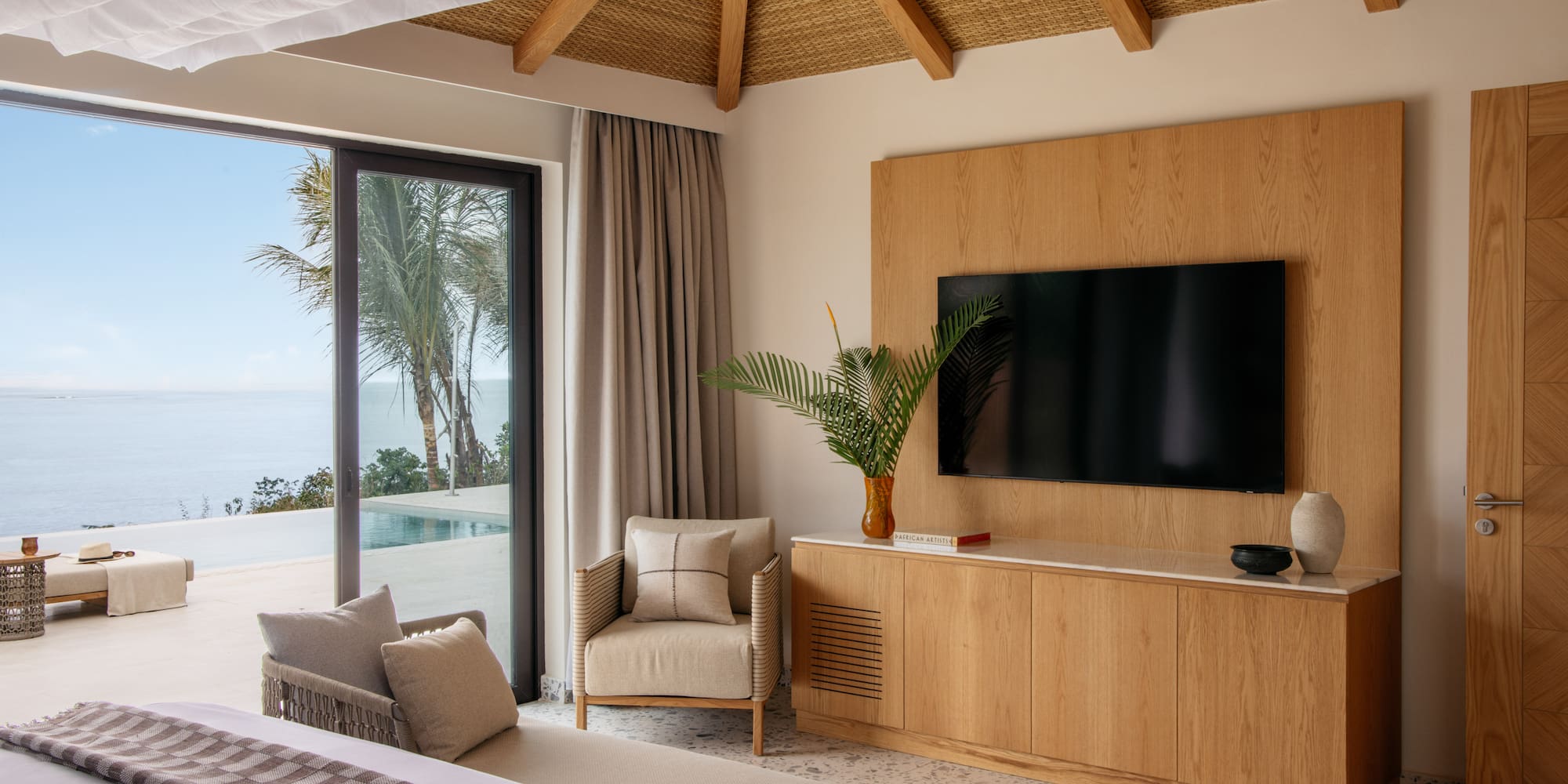 a room with a television and a large bed