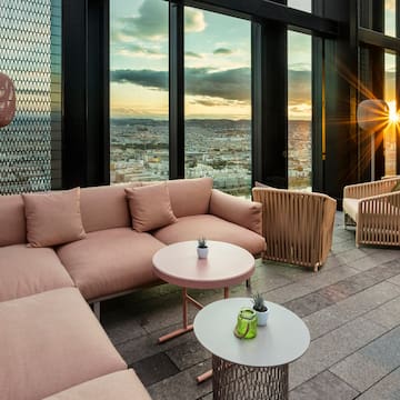 a room with a couch and chairs and a table