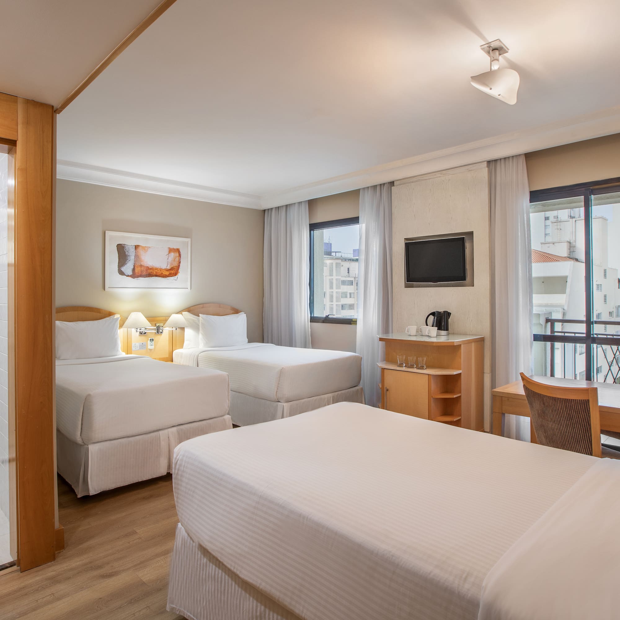 a room with two beds and a table