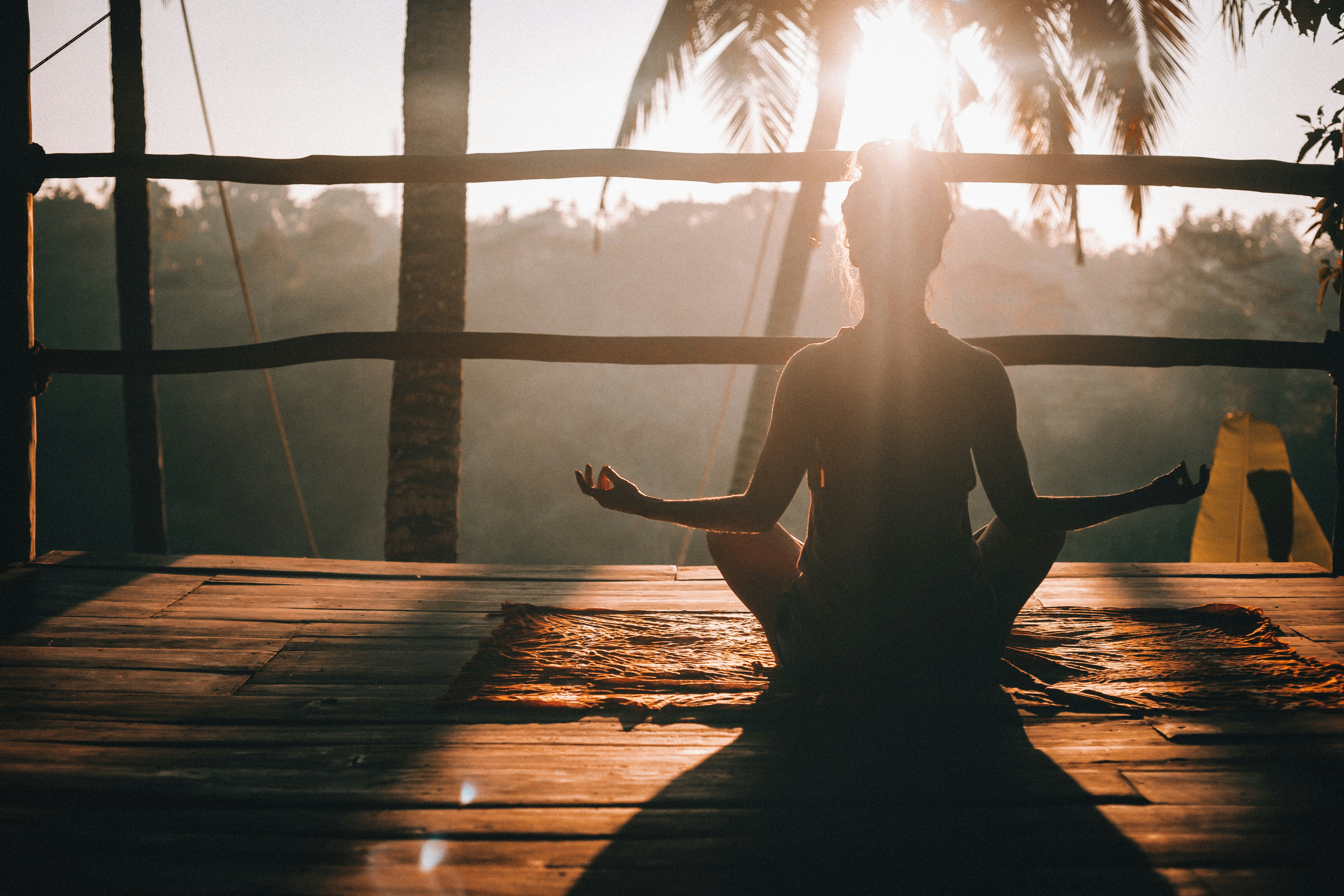 a person sitting in a yoga pose