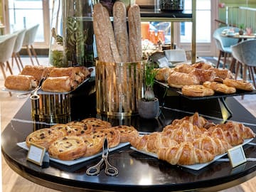 a table with pastries and bread