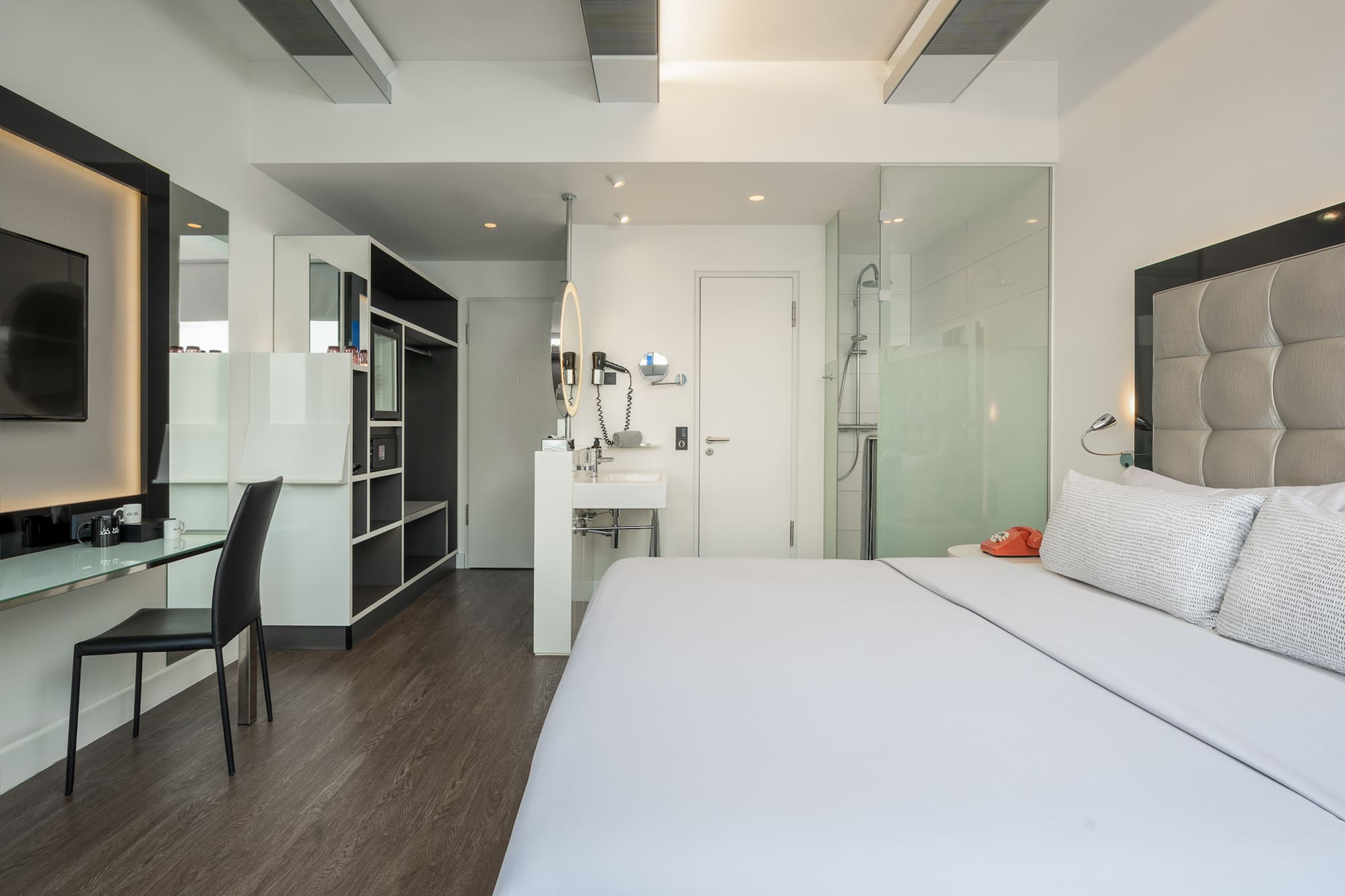 a room with a bed and a sink