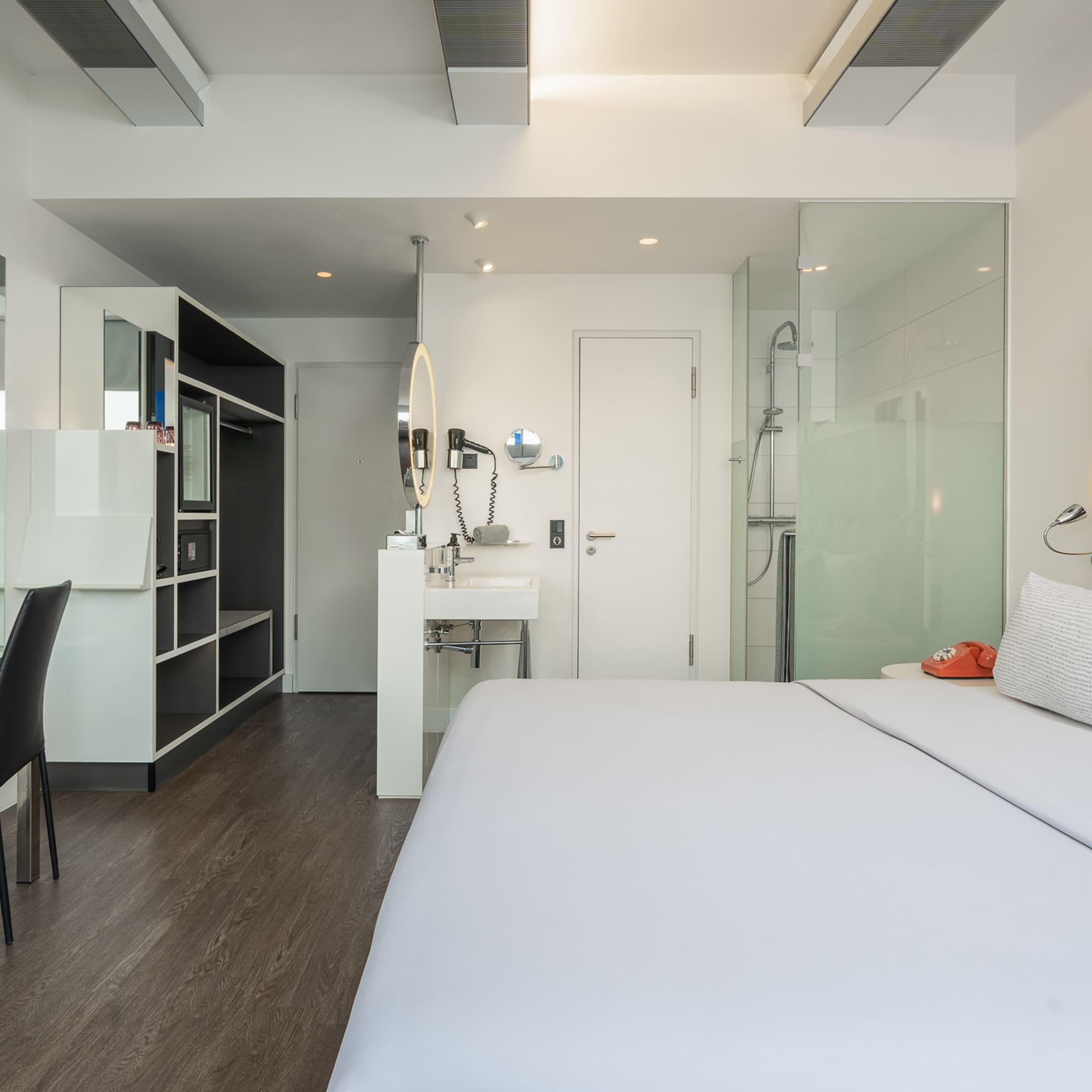 a room with a bed and a sink