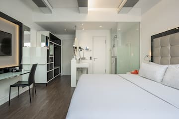 a room with a bed and a sink