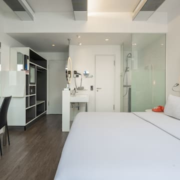 a room with a bed and a sink