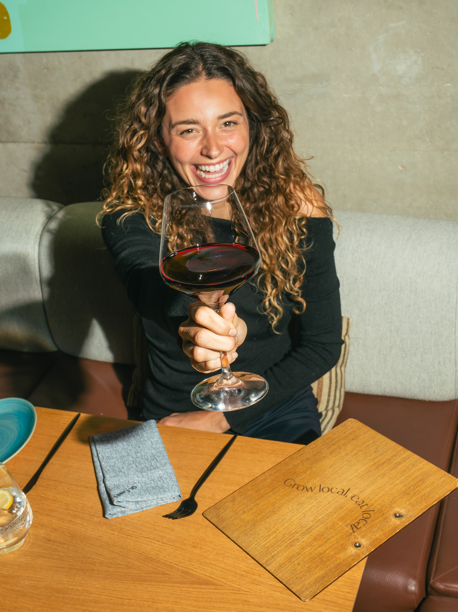 a woman holding a glass of wine