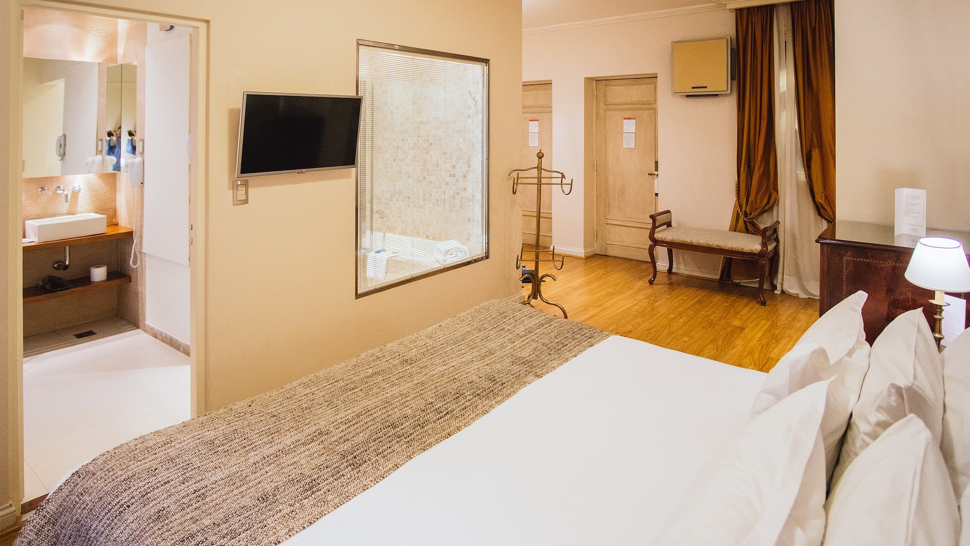 a room with a bed and a mirror