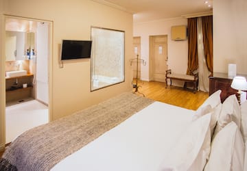 a room with a bed and a mirror