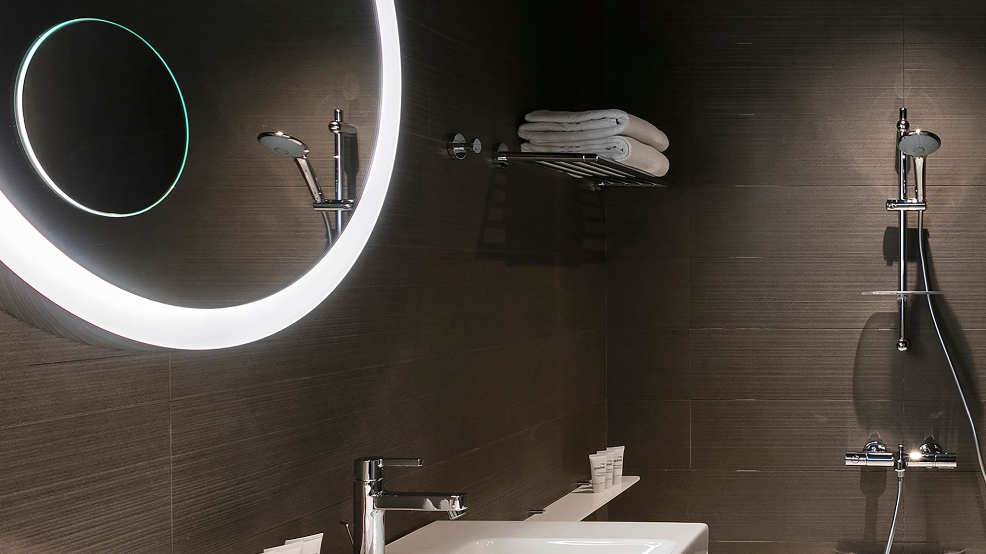 a bathroom with a round mirror
