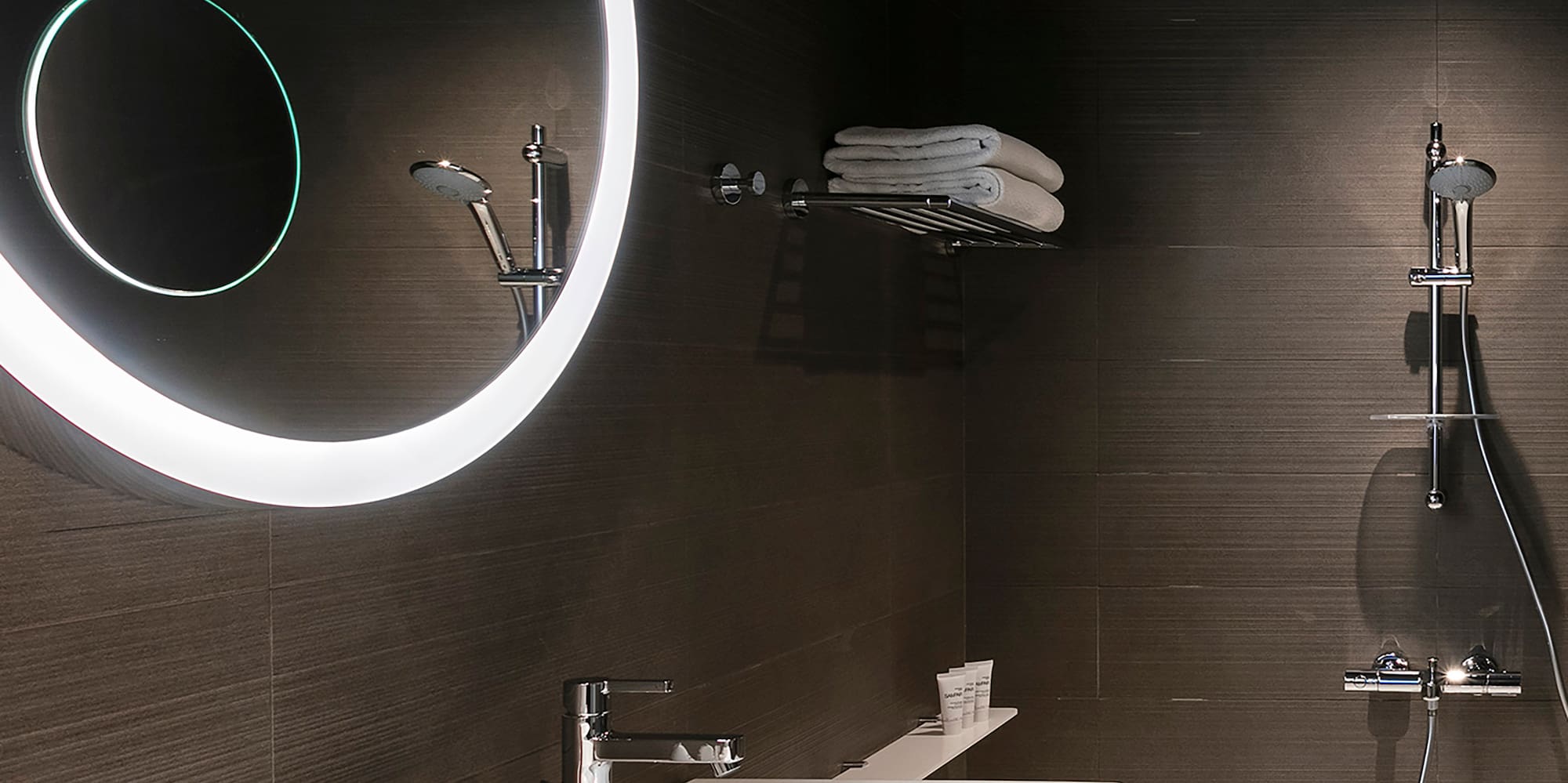 a bathroom with a round mirror