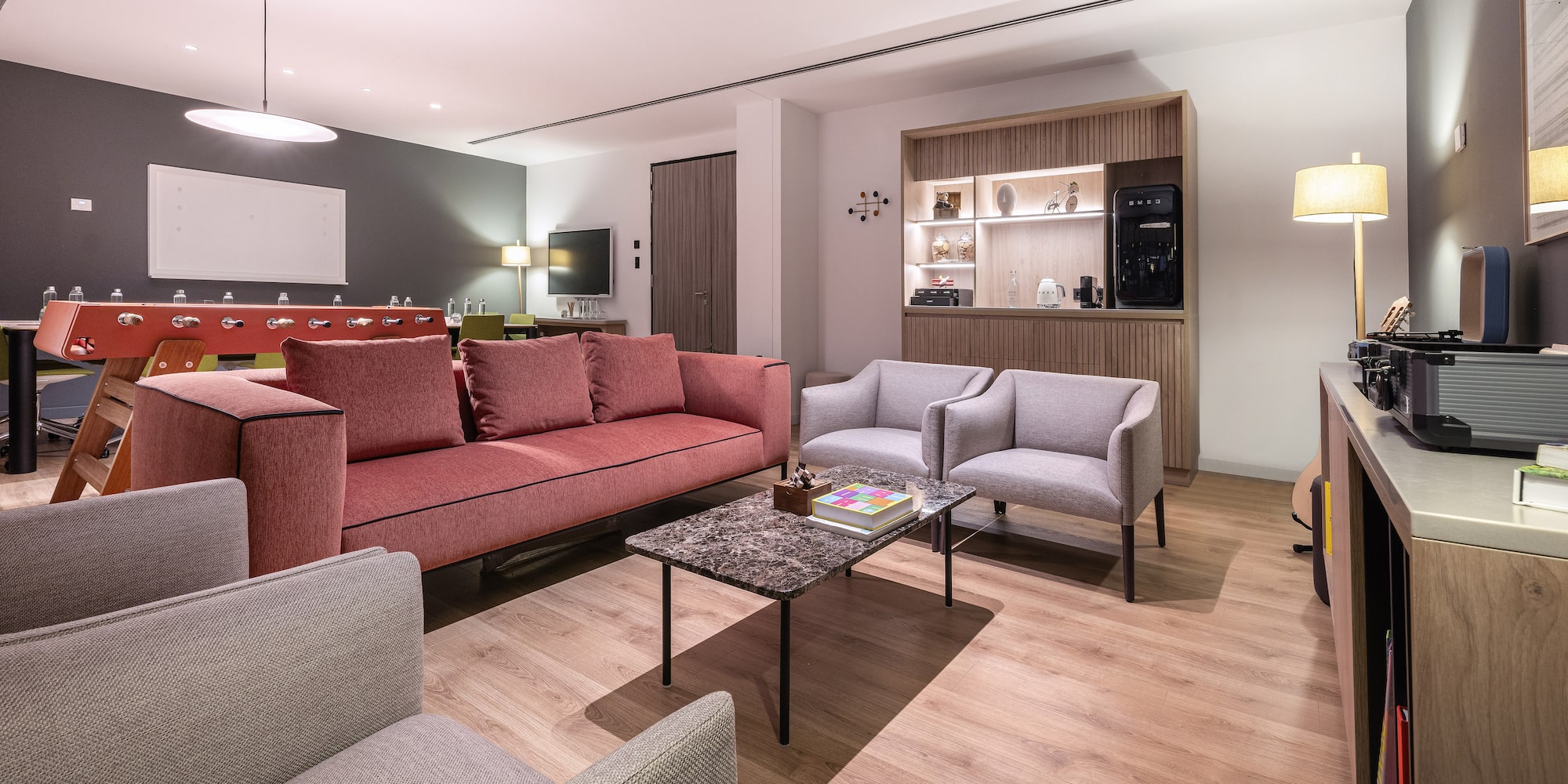 a living room with a couch and chairs