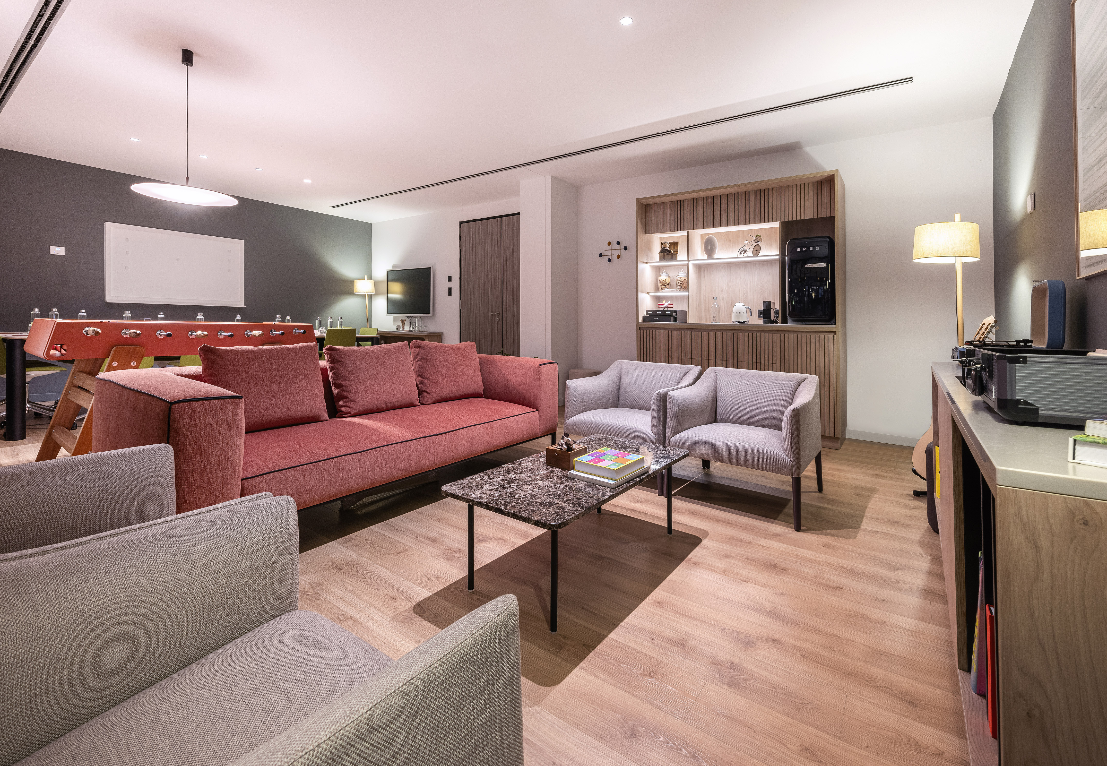 a living room with a couch and chairs