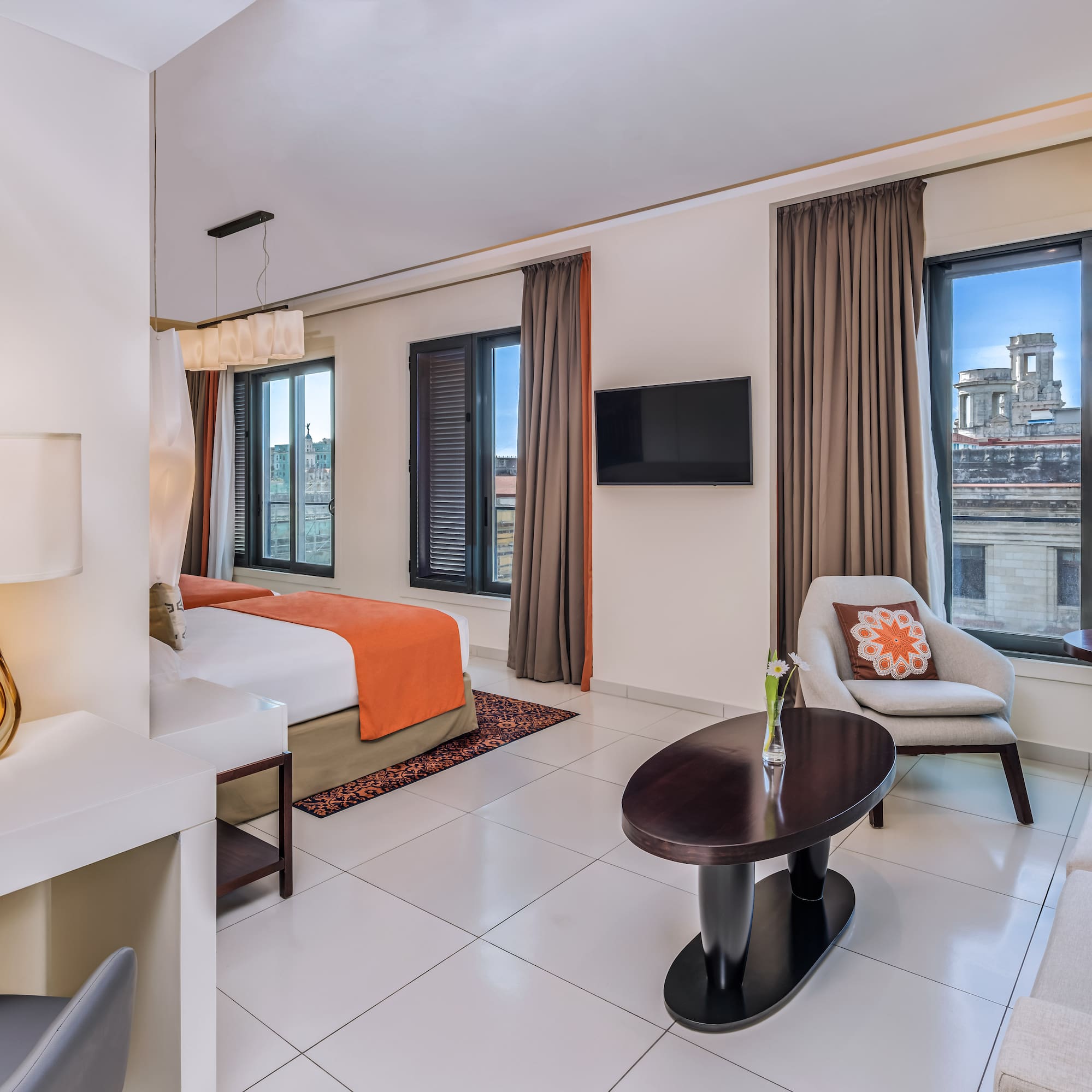 a room with a bed and a tv