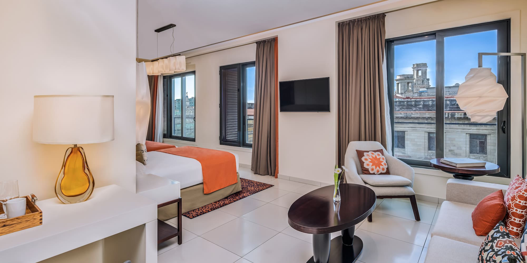 a room with a bed and a tv