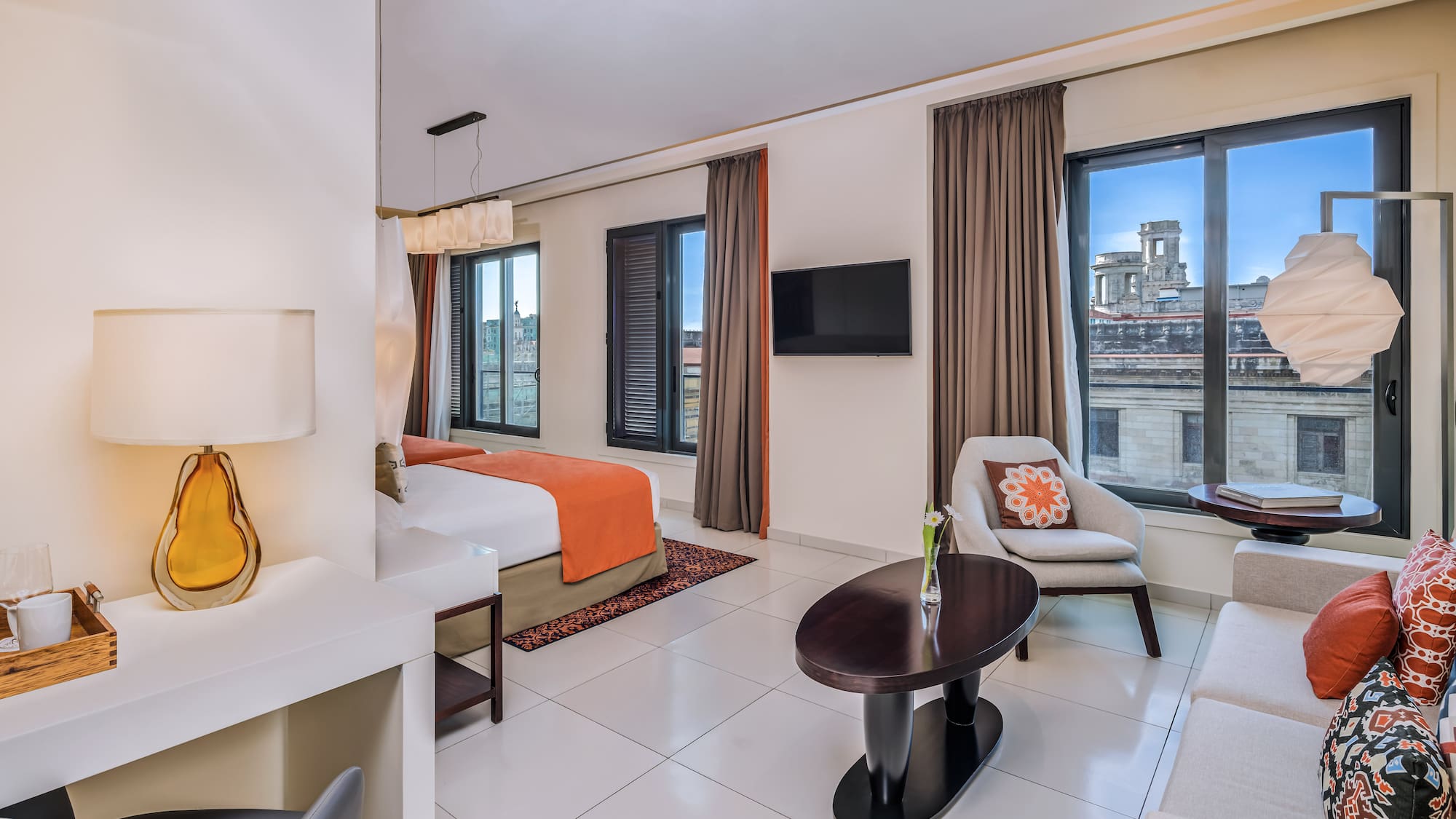 a room with a bed and a tv