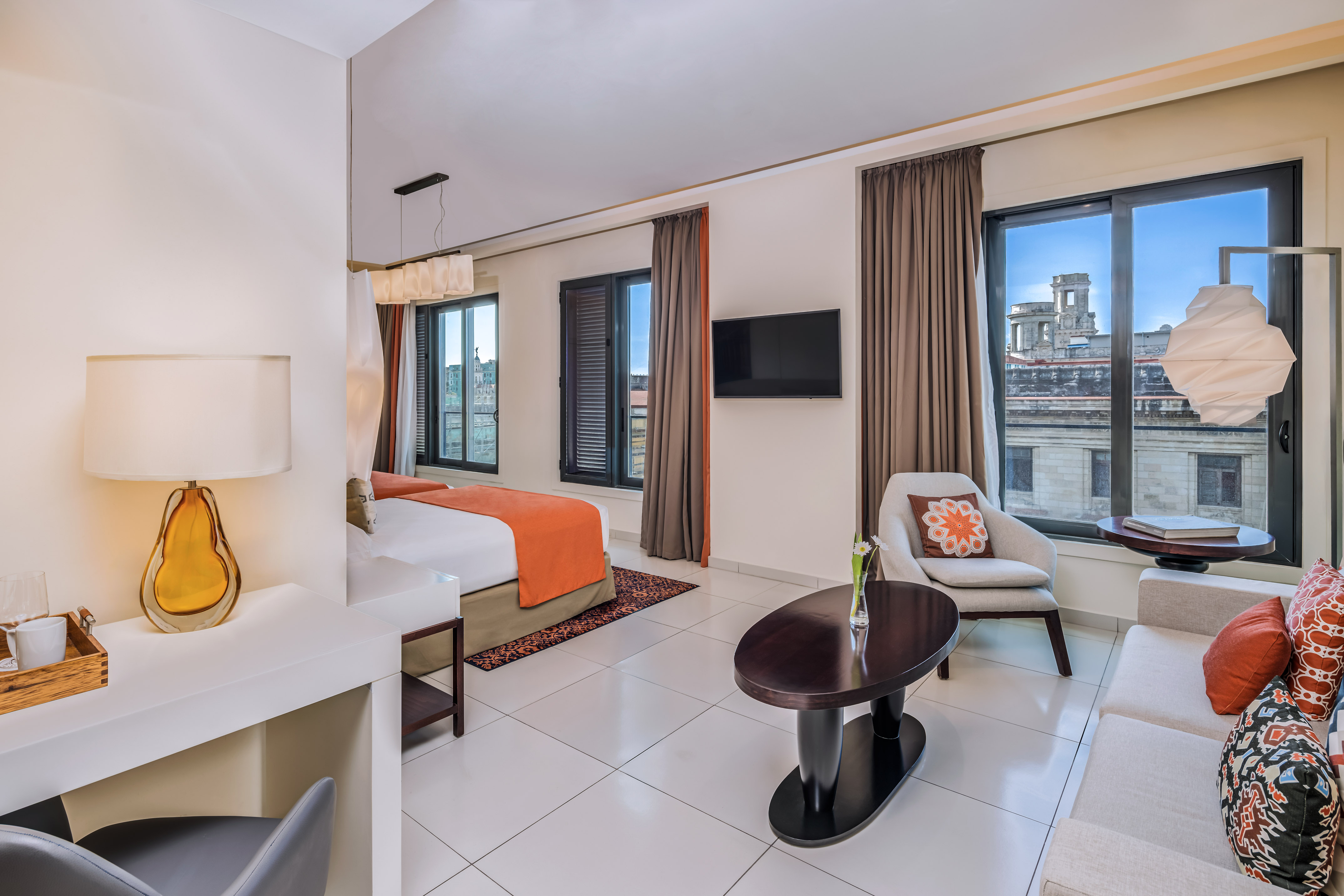 a room with a bed and a tv