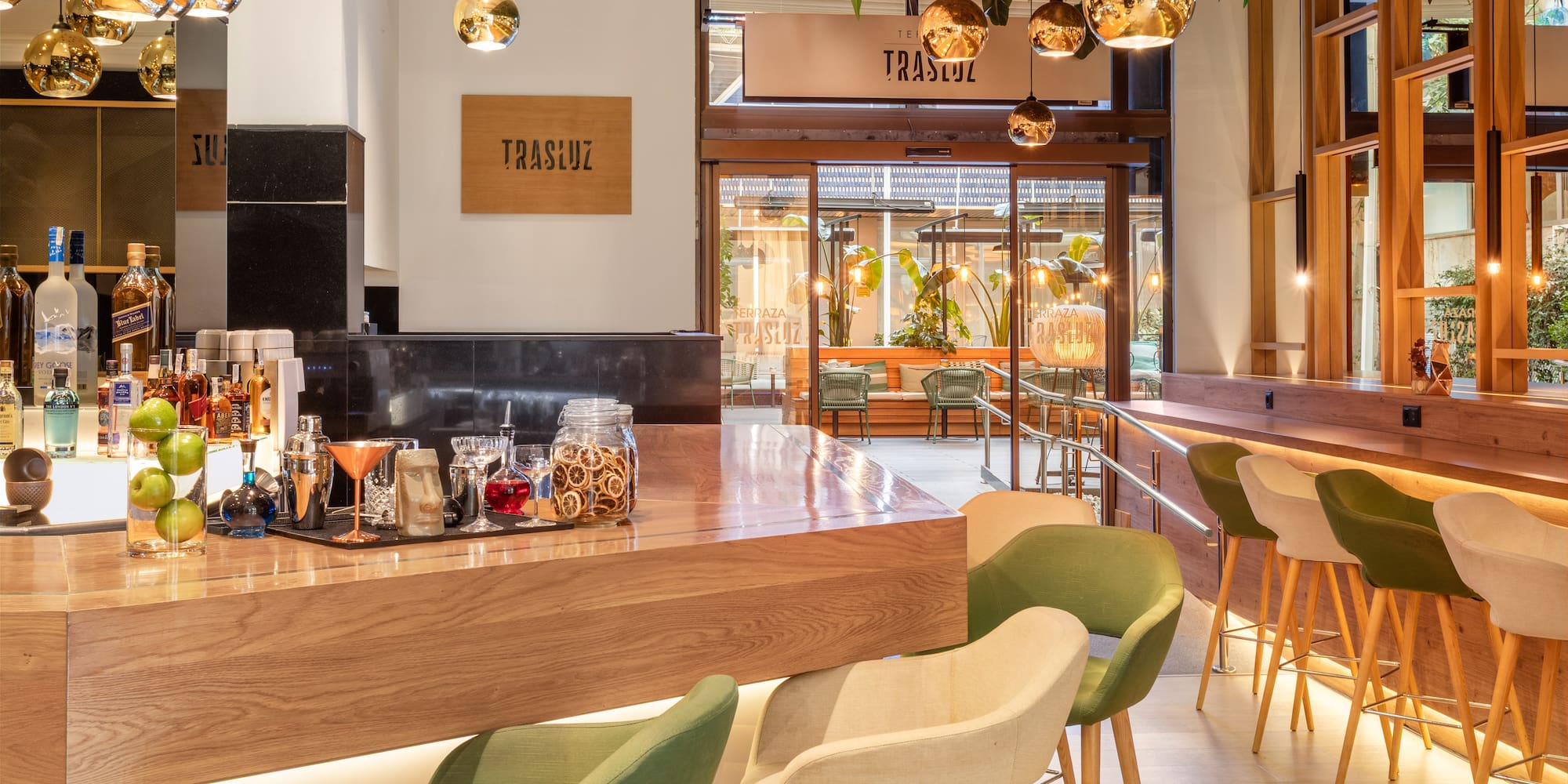 a bar with a counter and chairs