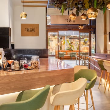 a bar with a counter and chairs